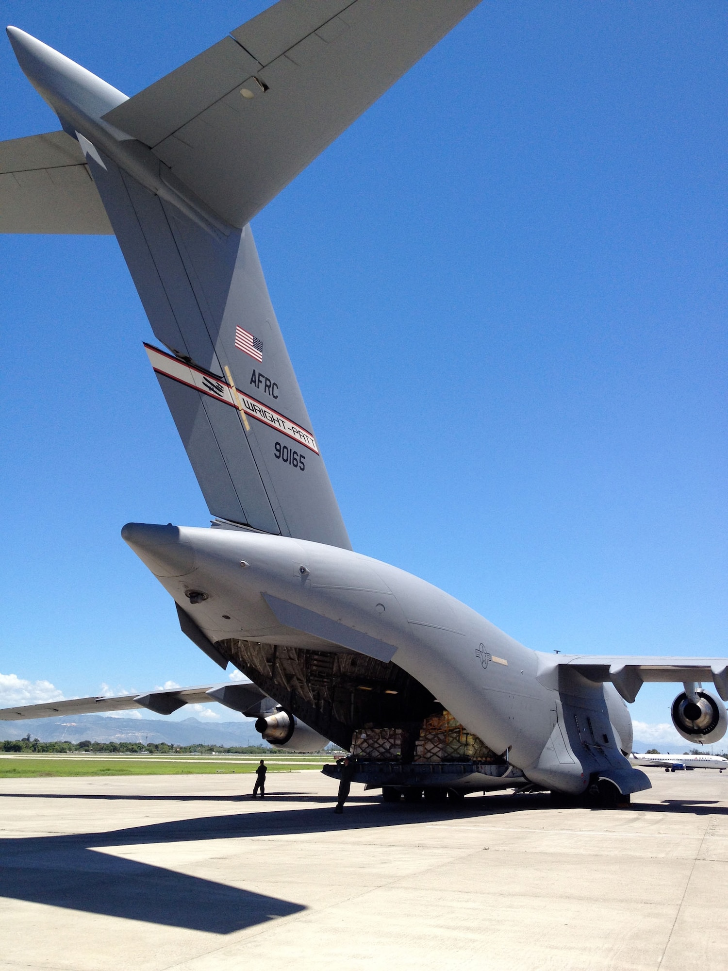 WRIGHT-PATTERSON AIR FORCE BASE, Ohio – Five pallets of cargo containing rice and other supplies needed in Haiti are unloaded from a 445th Airlift Wing C-17 Globemaster III Aug. 31. The C-17 moved more than 105,000 pounds of cargo to and from Joint Base Charleston, S.C., to Haiti as part of the Denton Program, a program that allows donors to use space available on U.S. military cargo planes to transport humanitarian goods and equipment to countries in need. (Courtesy photo)