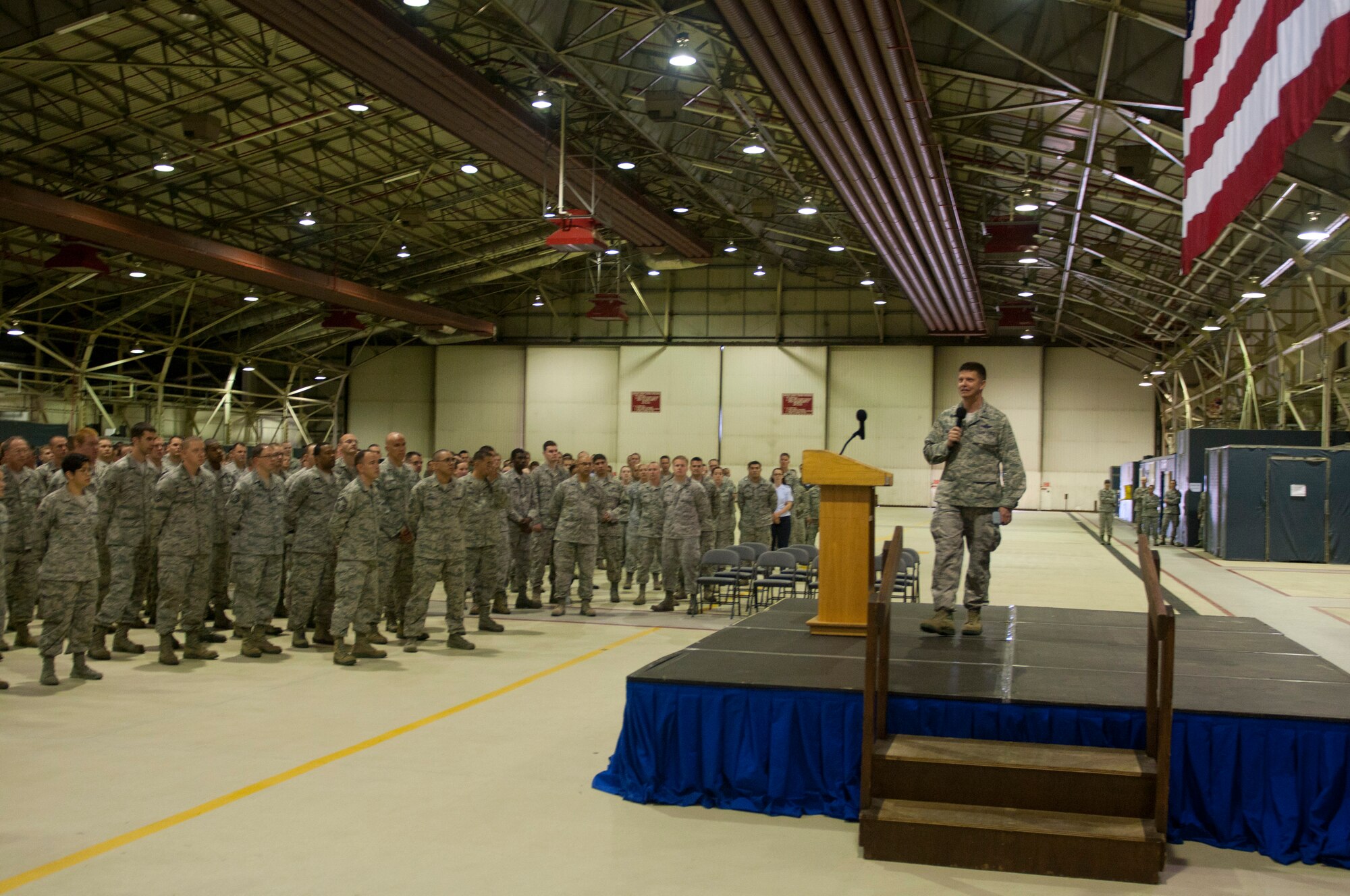ROYAL AIR FORCE LAKENHEATH, England – Col. Kyle Robinson, 48th Fighter Wing commander, addresses Liberty Wing Airmen during a commander’s call at Hangar 7 Aug. 27, 2012. Robinson covered current wing issues and answered questions during the call. (U.S. Air Force photo by Staff Sgt. Stephen Linch)