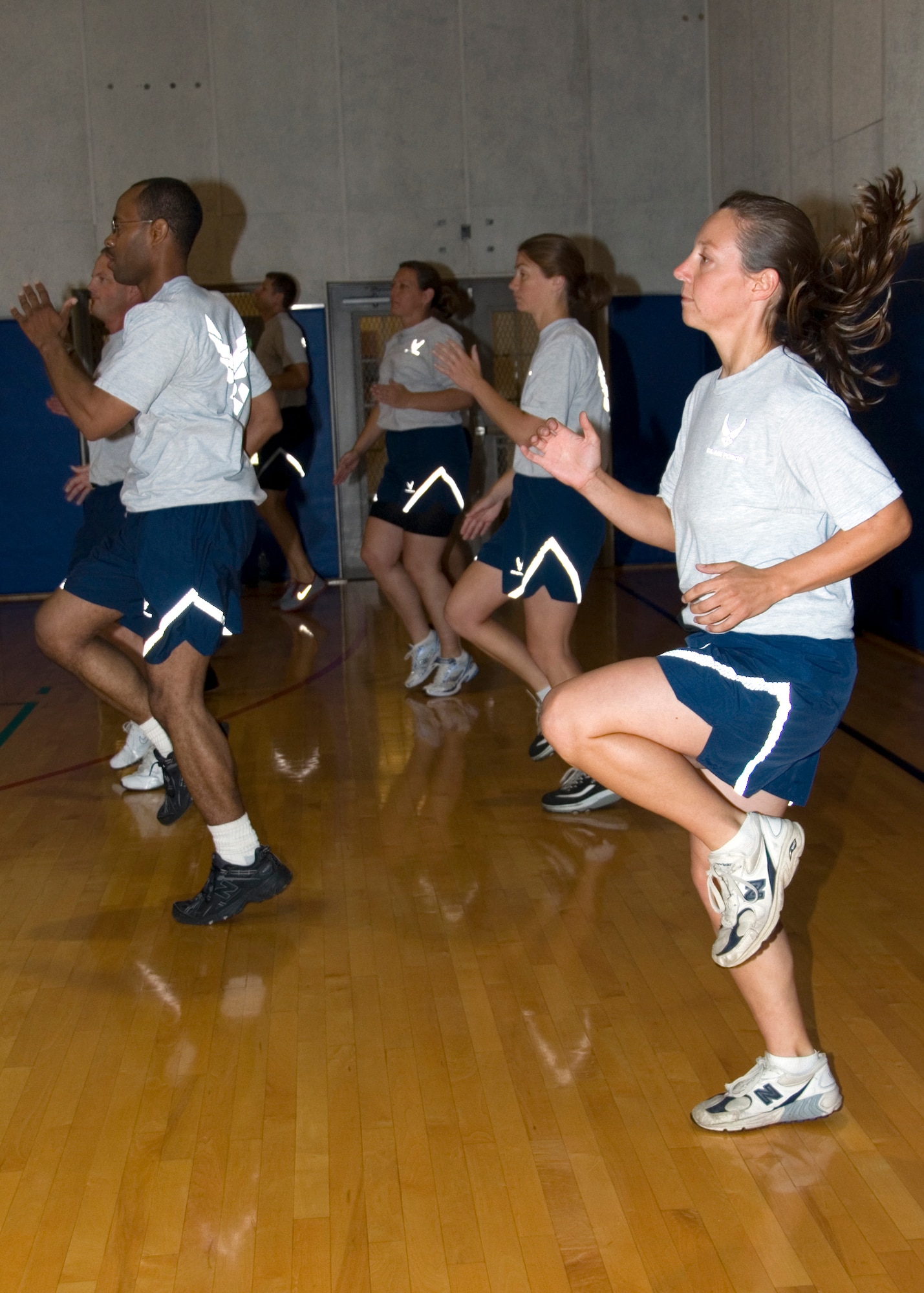 GRISSOM AIR RESERVE BASE, Ind. -- Grissom Airmen warm-up during a certification course to become military exercise leaders here Aug. 4. The course provides training to develop skills for those who lead group exercise programs. (U.S. Air Force photo/Staff Sgt. Carl Berry)