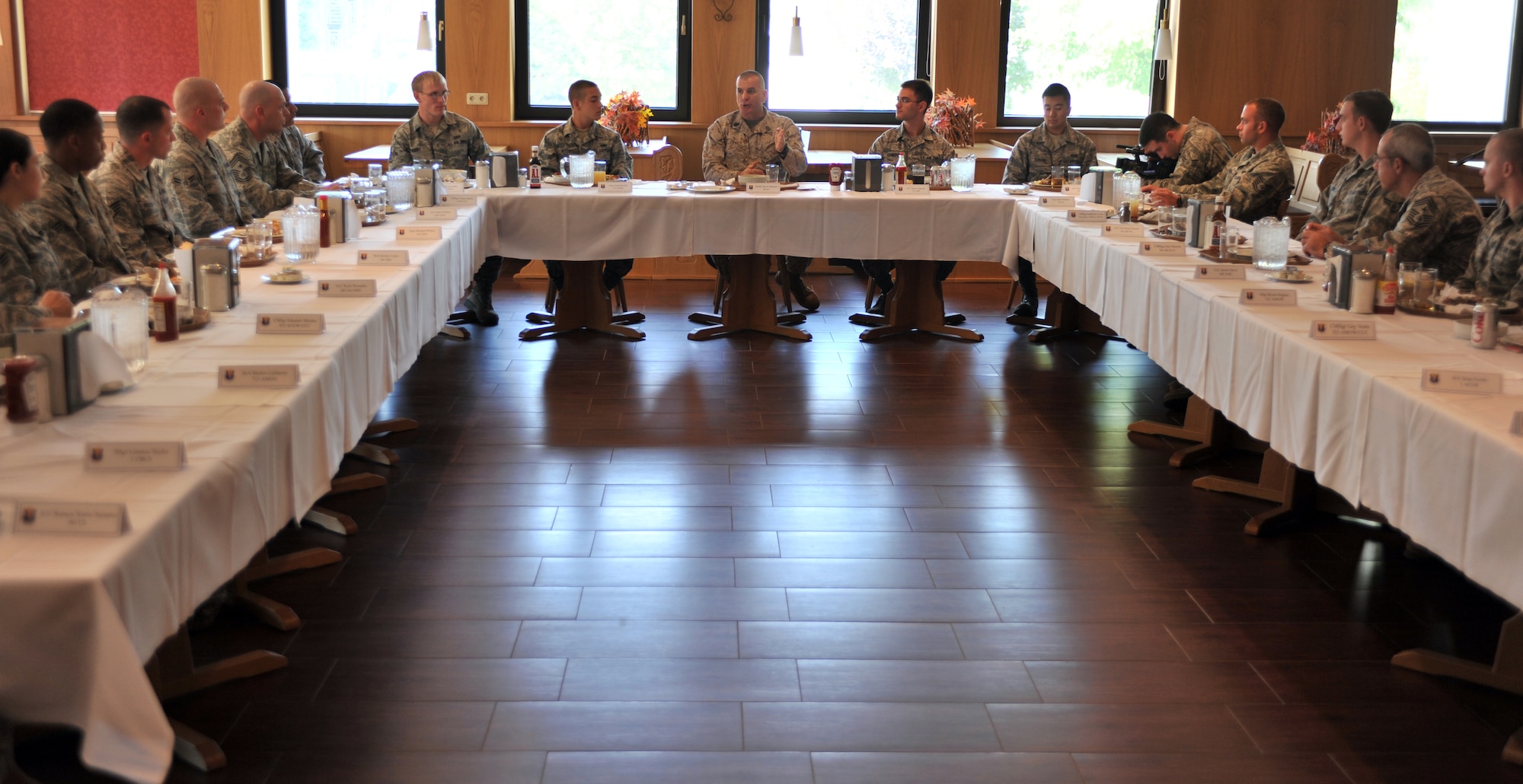 Sgt. Maj. Bryan Battaglia, Senior Enlisted Advisor to the Chairman of the Joint Chiefs of Staff, speaks with Airman at the Rhineland Dining Facility on Ramstein, Germany, Sept. 4, 2012. This visit gave the Kaiserslautern Military Community the opportunity to show Battaglia the strategic contributions of the joint forces within the KMC. (U.S. Air Force/Senior Airman Caitlin O’Neil-McKeown)
