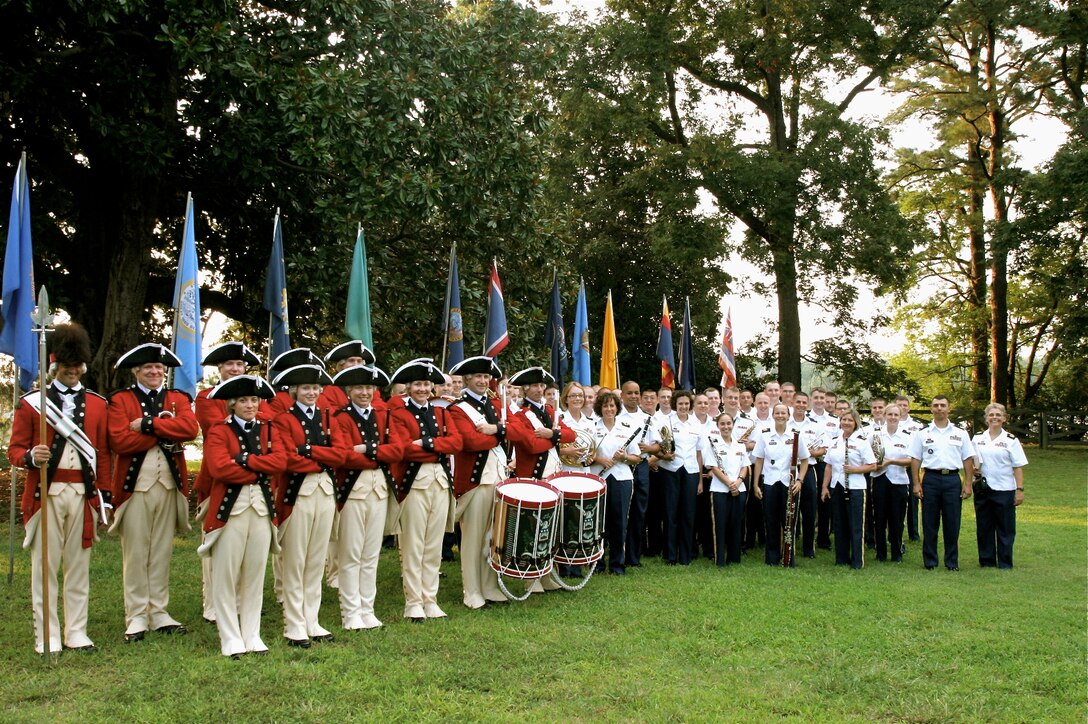 The U.S. Army Old Guard Fife and Drum Corps from Fort Myer, Va., pause for a moment of recognition Aug. 30, before the final event of the 2012 Music Under the Stars summer concert series at Fort Eustis, Va. An audience of 800 enjoyed the United States Army Training and Doctrine Command Band’s season finale of its annual Music Under the Stars concert series. (Courtesy photo by Staff Sgt. Jose Pomales / Released)