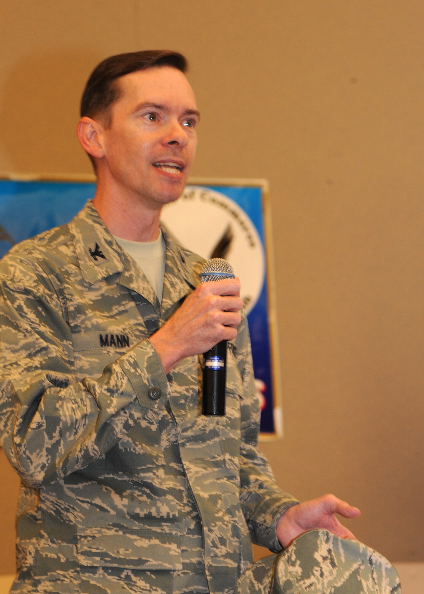 Col. Christopher Mann, 319th Air Base Wing vice commander, speaks at the University of North Dakota Military Appreciation Day tailgate buffet before UND squared off against the South Dakota School of Mines and Technology Aug. 30, 2012, at the Alerus Center in Grand Forks, N.D. The event was co-sponsored by UND and the Grand Forks and East Grand Forks, Minn., Chamber of Commerce Military Affairs Committee. Mann thanked both the MAC and UND for sponsoring such an enjoyable event. (U.S. Air Force photo by Senior Airman Susan L. Davis)
