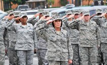 A formation of Airmen from the Air Force Reserve Command Readiness Management Group led by Col. Patti Frisbie, RMG deputy commander, salute during a retreat ceremony Aug. 30.  (U. S. Air Force photo/Sue Sapp)