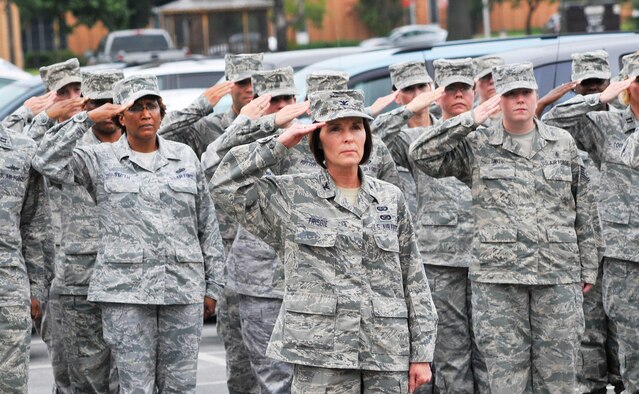 A formation of Airmen from the Air Force Reserve Command Readiness Management Group led by Col. Patti Frisbie, RMG deputy commander, salute during a retreat ceremony Aug. 30.  (U. S. Air Force photo/Sue Sapp)