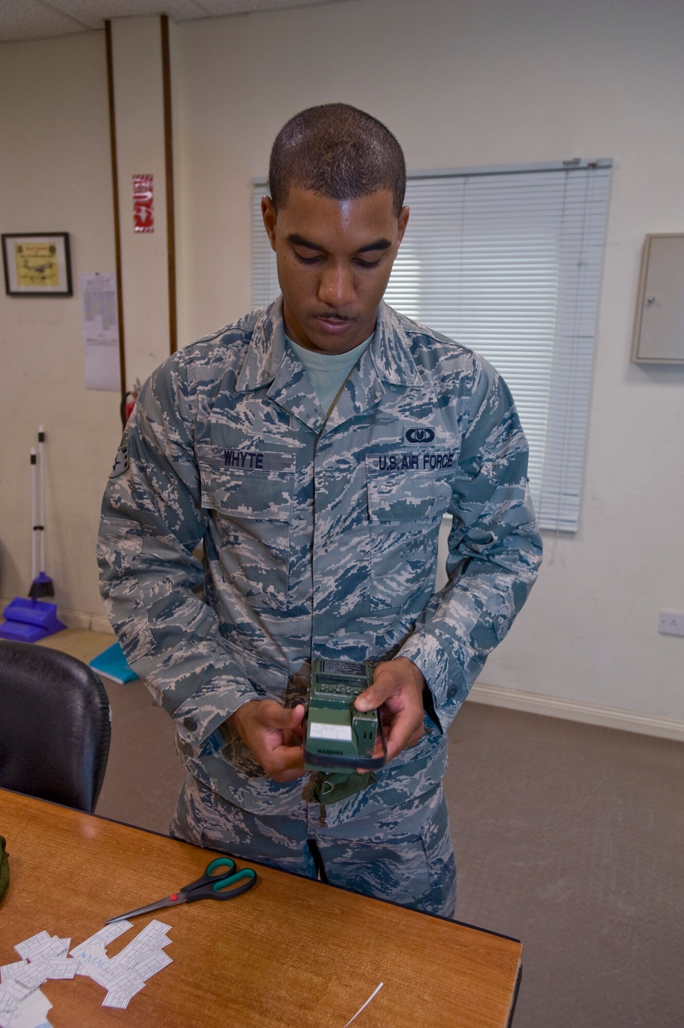 Senior Airman Brandon Whyte, 379th Aircrew Flight Equipment C-130 Hercules technician, performs a routine maintenance check on the C-130 crew’s satellite radio and global positioning system Aug. 21, 2012. Whyte is deployed from Kadena Air Base, Japan, and is a native of Fort Bragg, N.C. (U.S. Air Force photo by Senior Airman Bryan Swink)