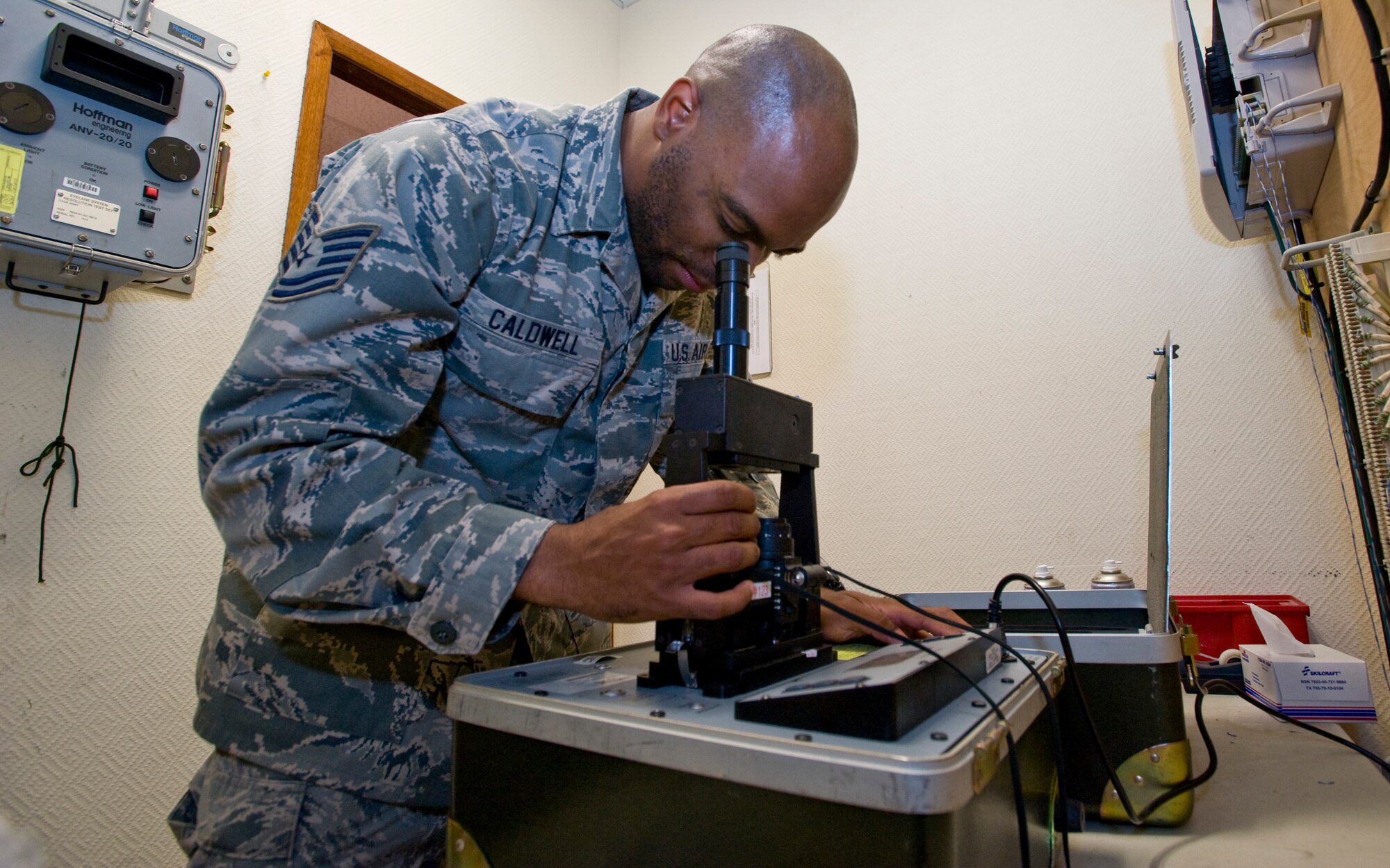 Tech. Sgt. Preston Caldwell, 379th Aircrew Flight Equipment C-130 Hercules technician, performs a routine inspection on night vision goggles using an ANV-126A Test Set Aug. 21, 2012. Caldwell inspects and maintains everything from life preservers, parachutes, floatation devices, helmets and oxygen masks to small things like glint tape and infrared glow sticks. He is deployed from Dobbins Air Reserve Base, Ga., and is a native of Florala, Ala. (U.S. Air Force photo by Senior Airman Bryan Swink)