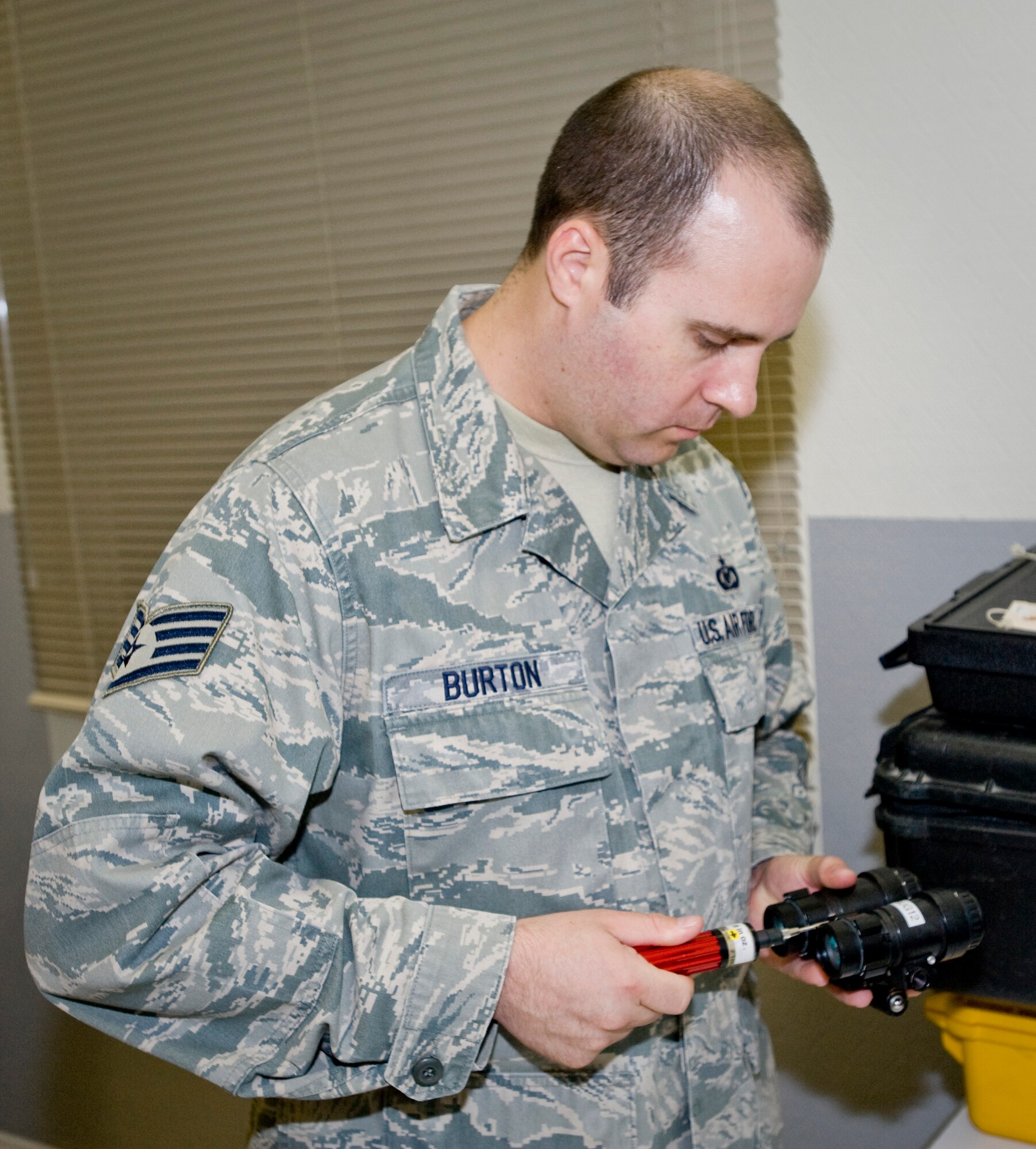 Staff Sgt. Jeremy Burton, 379th Aircrew Flight Equipment KC-135 Stratotanker technician, conducts a 180-day visual inspection on night vision goggles to ensure every piece is in complete working order Aug. 21, 2012. Burton is deployed from McConnell Air Force Base, Kan., and is a native to Clearlake, Calif. (U.S. Air Force photo by Senior Airman Bryan Swink)