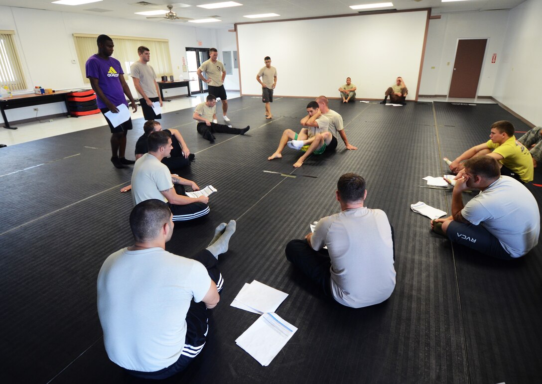 FORT JUAN MUNA, Guam—Security Forces members from Andersen Air Force Base participate in an Air Force combative course, Aug. 30. During the class, participants were taught the proper way to strike and grapple during hand-to-hand combat situations. (U.S. Air Force photo by Senior Airman Benjamin Wiseman/Released)