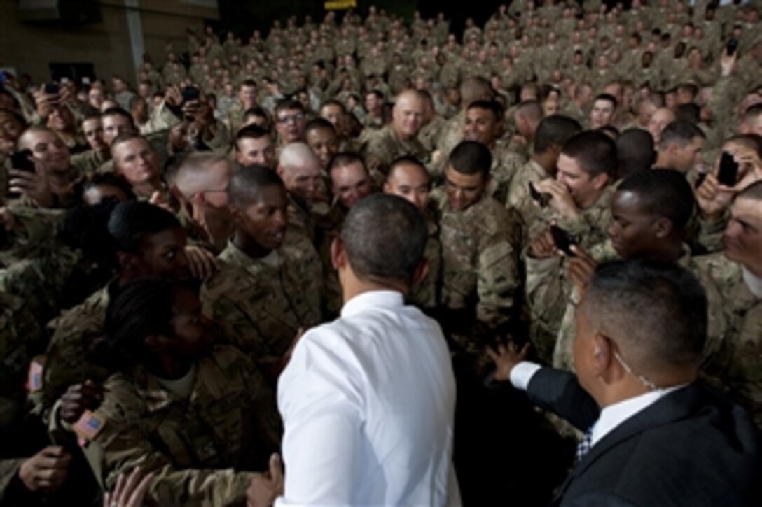 President Barack Obama wades into a crowd of soldiers for handshakes during a visit to Ft. Bliss, Texas, on Aug. 31, 2012.  