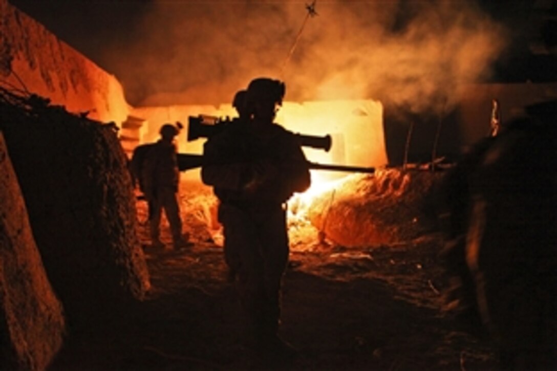 U.S. Marines exit a compound in Agha Ahmad in Afghanistan's Helmand province, Aug. 27, 2012. The Marines are assigned to Scout Sniper Platoon, Alpha Company, 1st Battalion, 1st Marines, Regimental Combat Team 6. 