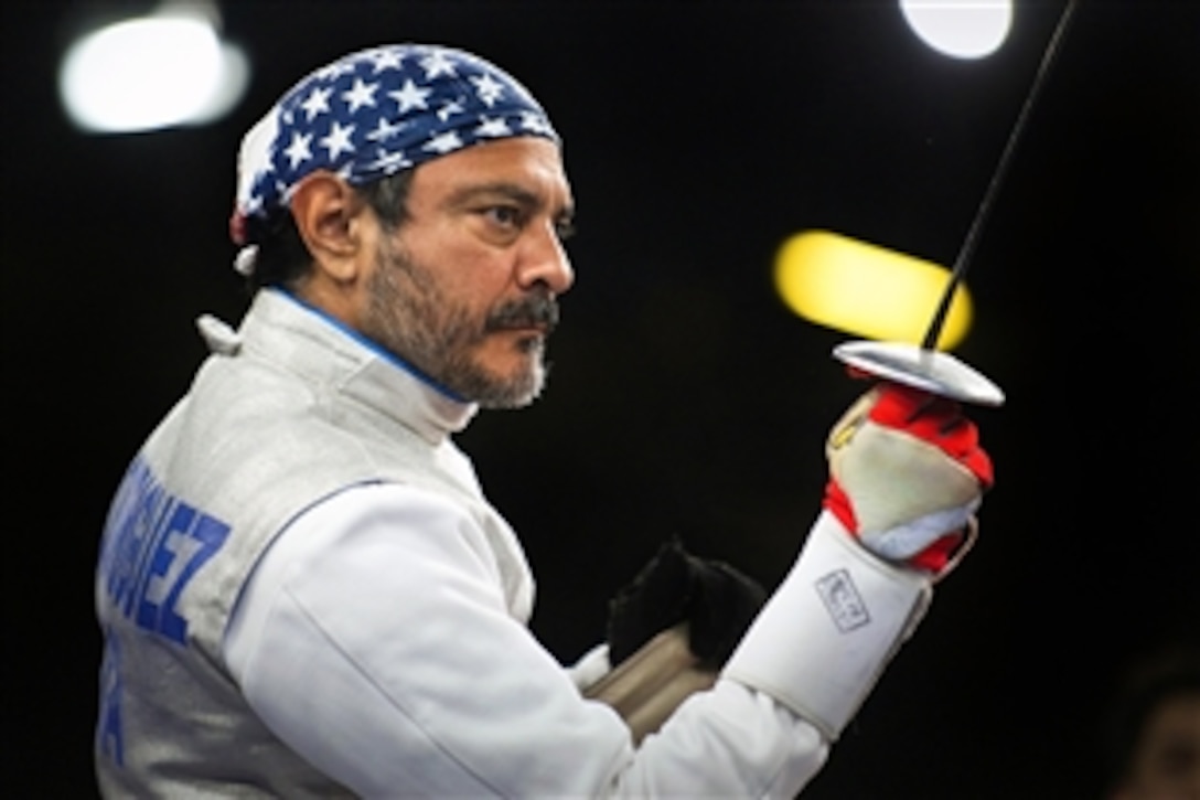 Mario Rodriguez, a former U.S. Air Force staff sergeant and a member of the 2012 U.S. Paralympic fencing team, stands ready before the start of a bout during the Paralympic Games at the ExCeL London exhibition and convention center in London, Sept. 4, 2012.