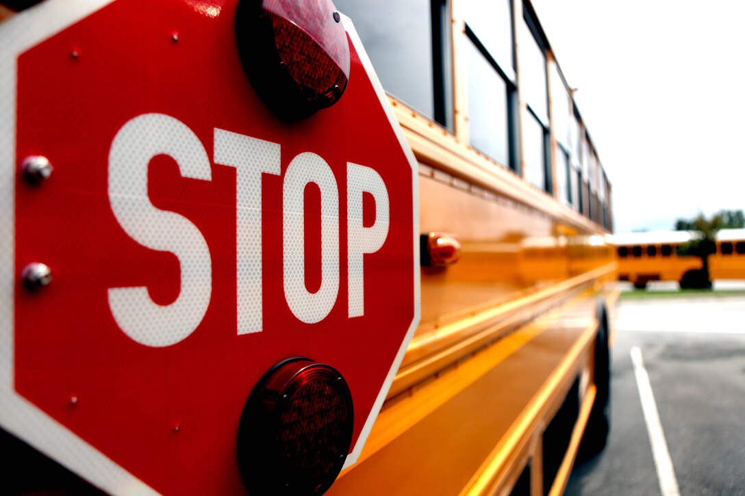 According to Base Order 5560.2N, no vehicle is to pass a school bus that is stopped, or in the process of stopping, to pick up or drop off children. Breaking this order will cost a driver a 90-day driving suspension on base.