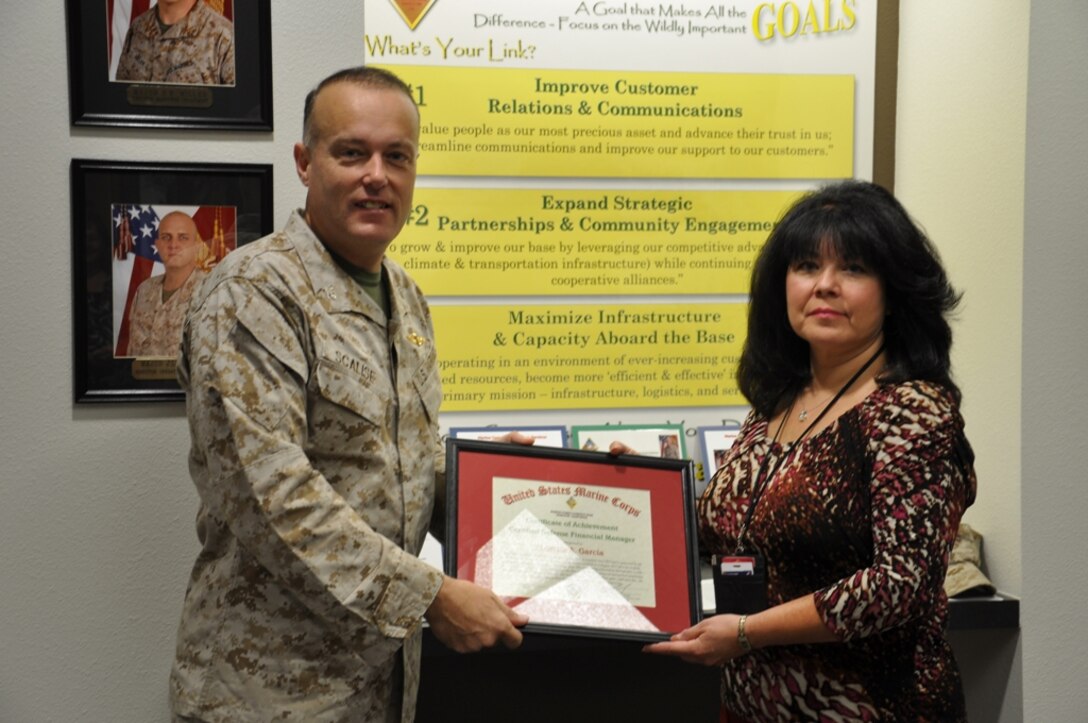 Lorella A. Garcia, the command’s fifth recipient, was presented the award to recognize the hard work she put in to become a certified financial manager.  