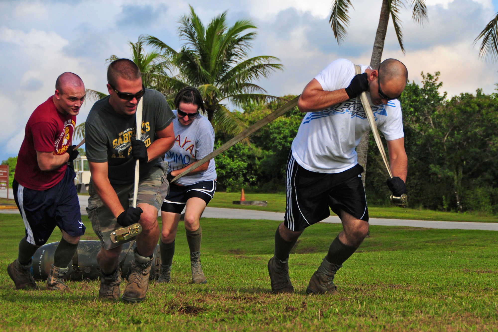 ANDERSEN AIR FORCE BASE, Guam – Airmen from the 36th Munitions Squadron work together to pull a 750 pound inert bomb during the Ammo Olympics here, Aug. 30. The Ammo Olympics is an annual event where the Airmen of 36th Munitions Squadron build teams and compete with each other in events that test the Airmen’s strength, teamwork and ingenuity. (U.S. Air Force photo by Airman 1st Class Marianique Santos/Released)