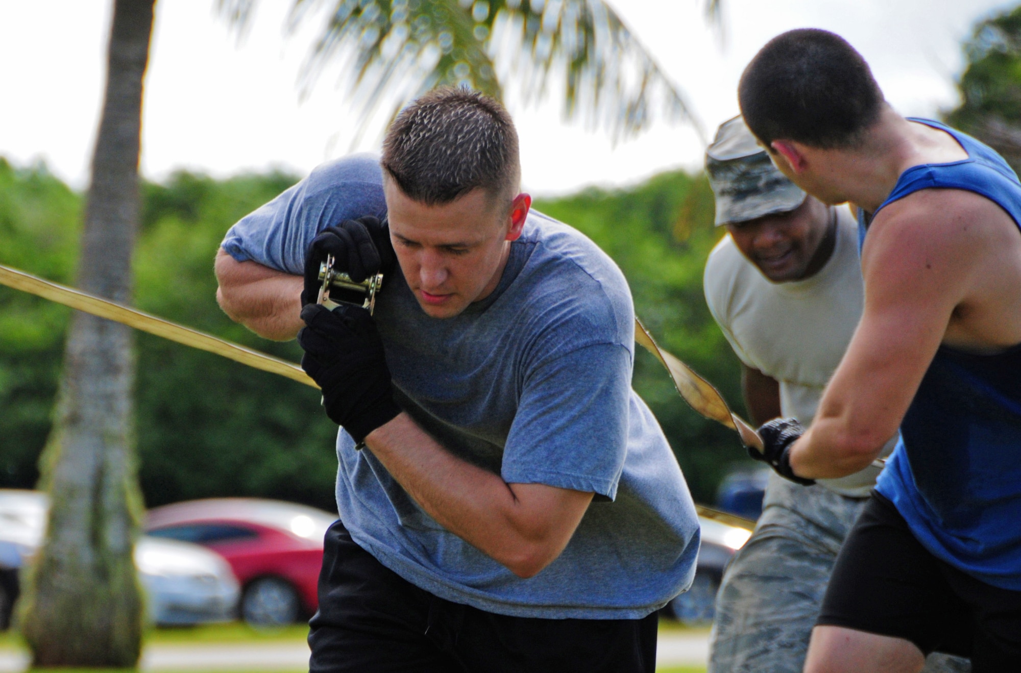 ANDERSEN AIR FORCE BASE, Guam -- Staff Sgt. Jason Harlan, 36th Munitions Squadron storage production noncommissioned officer in charge, works with his team during the 750 pound inert bomb pull during the Ammo Olympics here, Aug. 30. The Ammo Olympics is an annual event where the Airmen of 36th Munitions Squadron build teams and compete with each other in events that test the Airmen’s strength, teamwork and ingenuity. (U.S. Air Force photo by Airman 1st Class Marianique Santos/Released)