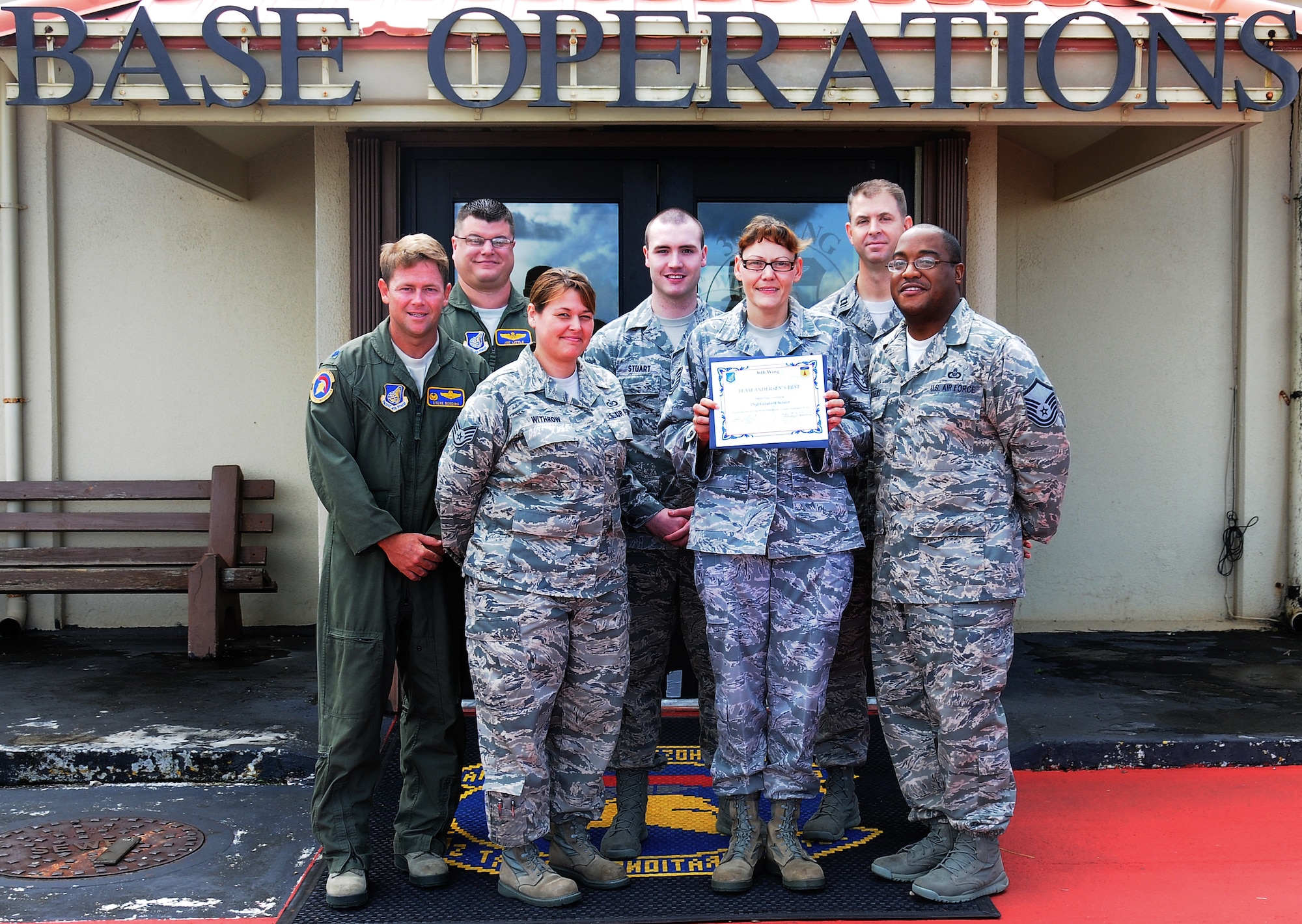ANDERSEN AIR FORCE BASE, Guam— Tech. Sgt. Elizabeth Scheid, 36th Wing Operations Support Squadron noncomissioned officer in charge of airfield management training, was awarded Team Andersen’s Best here Aug. 30. Andersen's Best is a recognition program which highlights a top performer from the 36th Wing. Each week, supervisors nominate a member of their team for outstanding performance and the wing commander presents the selected Airman/civilian with an award. To nominate your Airman/civilian for Andersen's Best, contact your unit chief or superintendent explaining their accomplishments. (U.S. Air Force photo by Airman 1st Class Mariah Haddenham/Released)