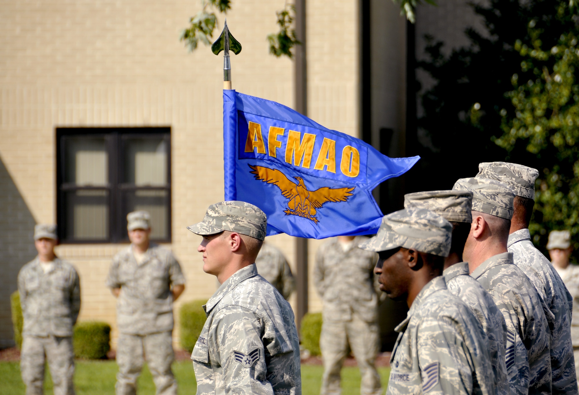 The men and women from Air Force Mortuary Affairs Operations stand in formation during the base retreat ceremony Aug, 31, 2012. Soldiers, Sailors, Airmen and Marines who support the mortuary mission participated in retreat. (U.S. Air Force photo/Staff Sgt. Caitlin Jones)