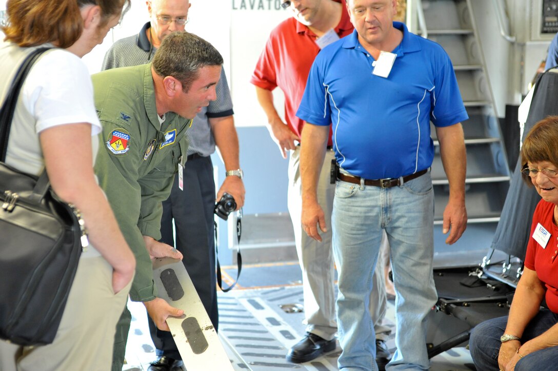 YOUNGSTOWN AIR RESERVE STATION, Ohio—U.S. Air Force Reserve Colonel Mike Major, vice commander of the 445th Airlift Wing, Wright-Patterson Air Force Base (WPAFB), Ohio, demonstrates capabilities of the C-17 military cargo aircraft during an ESGR funded Boss Lift from Youngstown Air Reserve Station, Ohio, to WPAFB. ESGR Boss Lifts are intended to provide employers the opportunity to experience and observe the work and mission of Guard and Reserve forces, building advocacy for Reservists and Guardsmen who deploy or require time away from civilian jobs for military duty. Employers are transported, via military aircraft or watercraft, to military facilities where they observe Guard and Reserve members on duty. U.S. Air Force photo by Mr. Eric M. White