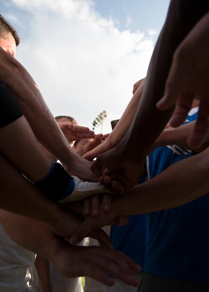 Members of the Dyess Football Club bring their hands together prior to a match Sept. 1, 2012, during the Defender’s Cup at San Antonio. Team Dyess went undefeated during the group portion of the tournament, beating Team Hill, Columbus and Medina. Having the top seed in their group gave Dyess a first-round bye on the second day of the tournament, where they faced Luke AFB. In a tough game, Luke defeated Dyess in penalty kicks after tying 1-1 during regulation. (U.S. Air Force photo by Airman 1st Class Damon Kasberg/Released)