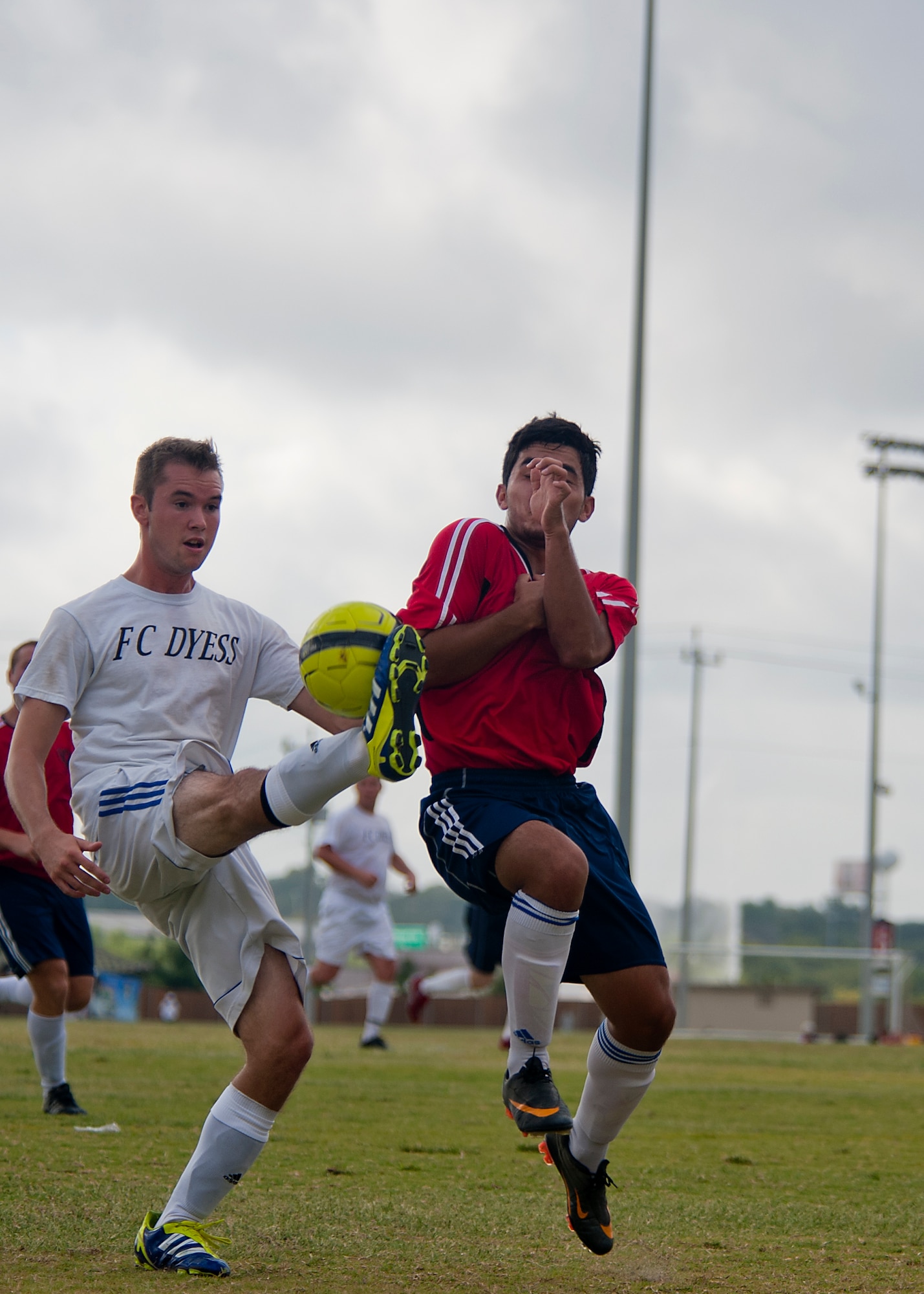 Dyess defender Daniel Urban kicks the ball away from an opponent Sept. 1, 2012, during the Defender’s Cup at San Antonio. During the first day of the tournament, teams were placed into groups of four and played each other to see where they would be placed in the tournament’s bracket. Team Dyess went undefeated during the group portion, beating Team Hill, Columbus and Medina. This placed them No. 1 in their group and fifth overall in the 22-team competition. Having the top seed in their group gave Dyess a first-round bye on the second day of the tournament, where they faced Luke AFB. In a tough game, Luke defeated Dyess in penalty kicks after tying 1-1 during regulation. (U.S. Air Force photo by Airman 1st Class Damon Kasberg/Released)
