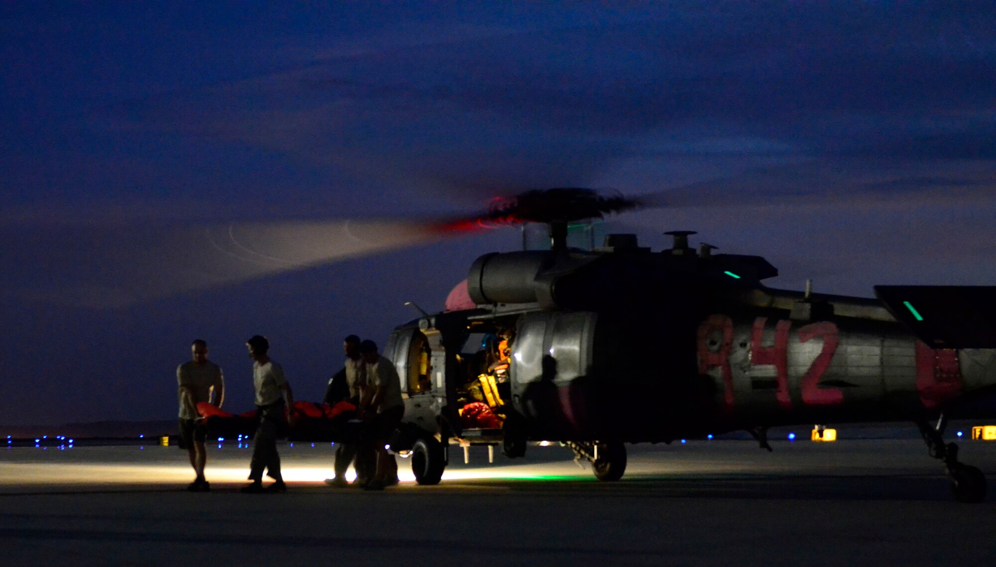 Members of the 129th Rescue Wing California Air National Guard assist in the rescue operations of two injured fisherman who were approximately 1400 miles off the coast of Acapulco, Mexico on Sept. 5, 2012.  (Air National Guard photo by Airman 1st Class John D. Pharr III)