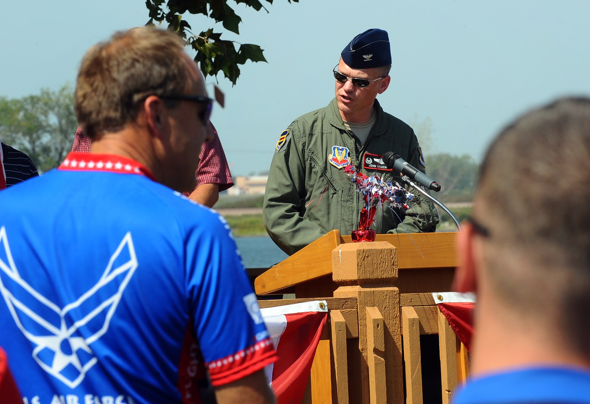 U.S. Air Force Col. John T. Rauch, 55th Wing commander, gives opening remarks at a ceremony hosted at the Base Lake by the Offutt Advisory Council at Offutt Air Force Base, Neb., Aug. 30.  The ceremony was hosted in honor of the five riders passing through Offutt AFB on their journey from Tacoma Wash. to Washington D.C. as part of the Long Road Home project.  (U.S. Air Force photo by Josh Plueger/Released).