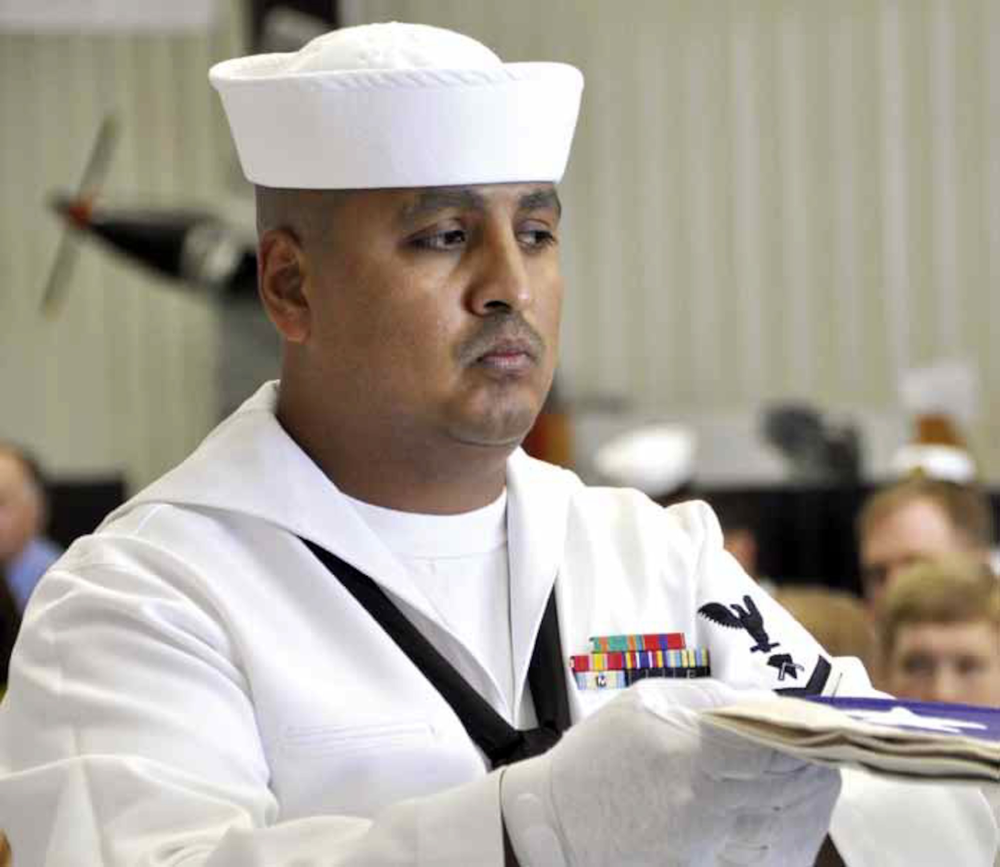 BU2 Marco Valdovinos is charged with overseeing the 28-member funeral honor team based at the Navy Operation Support Center Moreno Valley, Calif. Their duties entail presenting honors at the funerals of fallen veterans throughout the southern Calif. regions. The team conducts an estimated 1,450 Navy funerals in a fiscal year, number two in the Nation. (U.S. Air Force photo by Darnell Gardner)