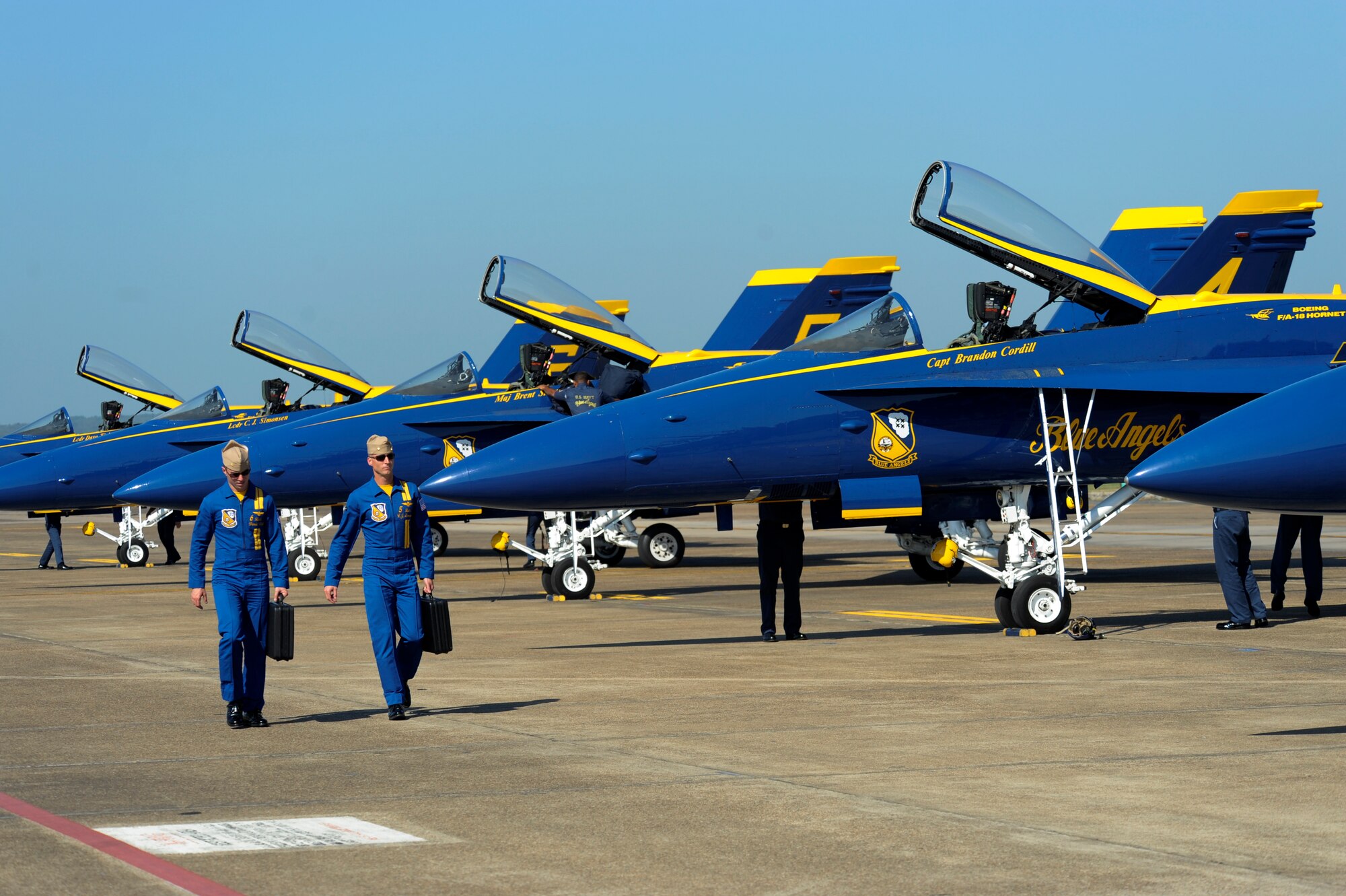 Members of the U.S. Navy Blue Angels walk on the flightline Sept. 6, 2012, at Little Rock Air Force Base, Ark. The Blue Angels F-18 Hornets are a team of seven aircraft that will perform at the 2012 Heritage and Heroes Open House and Airshow held Sept. 8-9th. (U.S. Air Force photo by Airman 1st Class Rusty Frank)