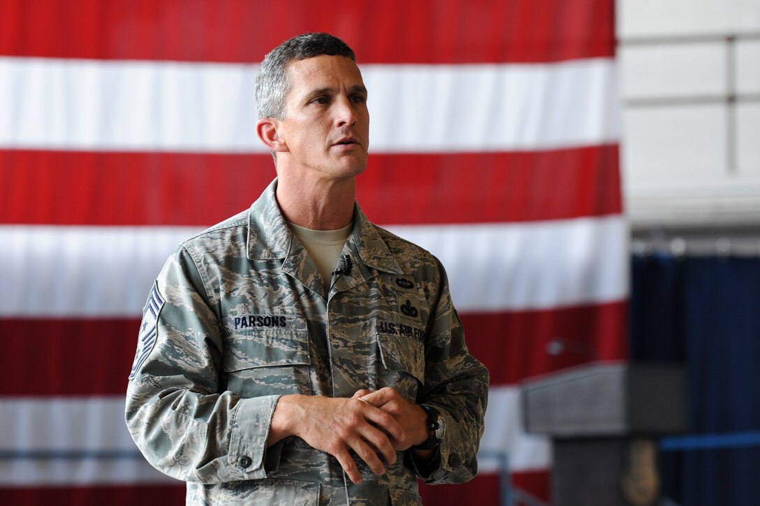 U.S. Air Force Chief Master Sgt. Richard Parsons, Air Combat Command command chief, speaks to Airmen about imminent changes affecting ACC and the Air Force as a whole during an "All-Call" on Ellsworth Air Force Base, S.D., Aug. 28, 2012. After the All-Call, Airmen were given the opportunity to voice their concerns regarding important issues such as budget cuts, promotions, retirement and performance reports. (U.S. Air Force photo by Airman 1st Class Kate Thornton-Maurer/Released)
