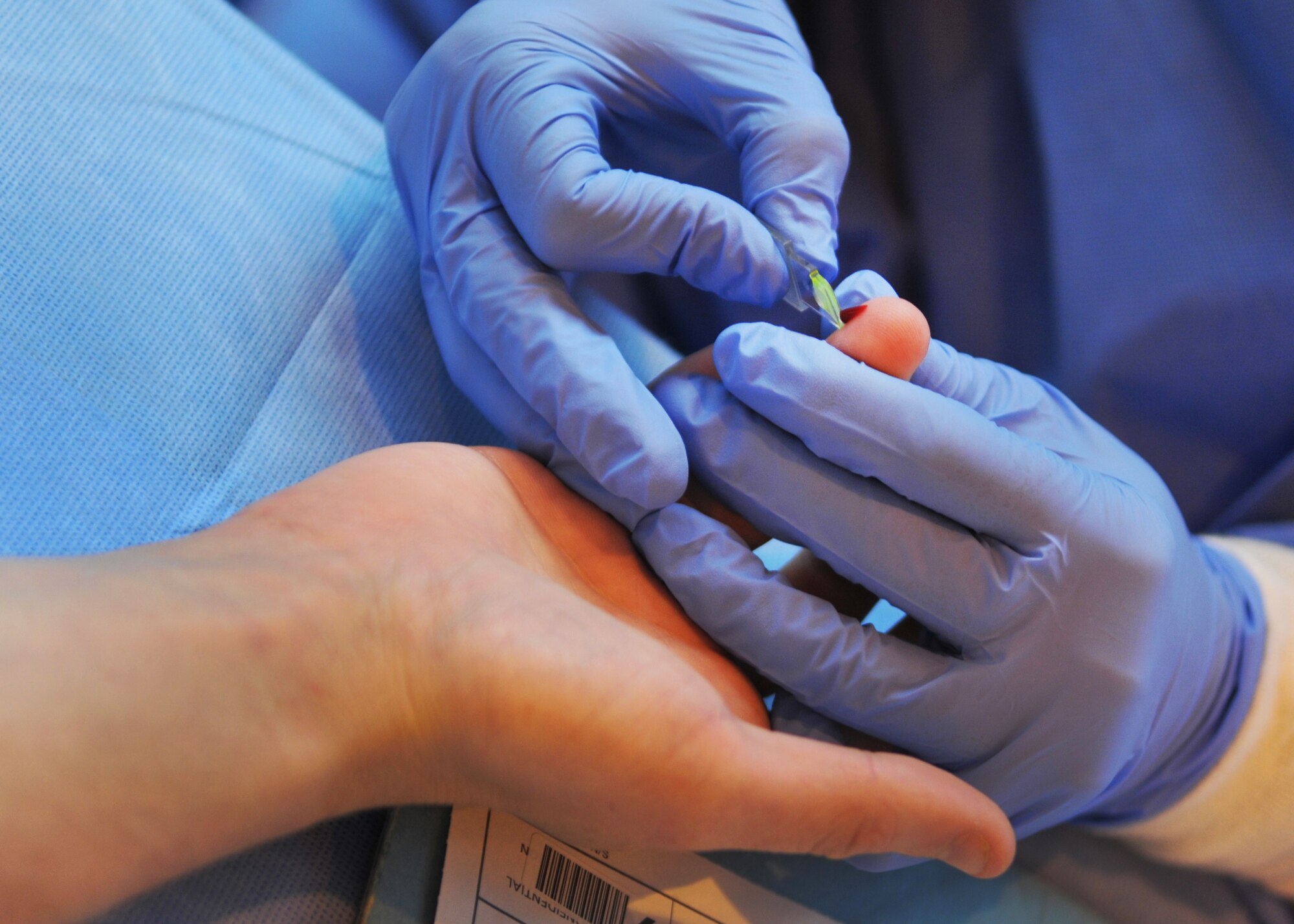 RAF MILDENHALL, England – Staff Sgt. Rachel Mays, 86th Medical Squadron Armed Services Blood Program Blood Donation Center laboratory technician, Landstuhl, Germany, takes a blood sample from Senior Airman Justin James, 488th Intelligence Squadron, during the ASBP Blood Drive, Sept. 5, 2012, at RAF Mildenhall, England.  James was one of more than 100 Team Mildenhall members that donated blood to the ASBP.  (U.S. Air Force photo/Staff Sgt. Tabitha M. Lee)