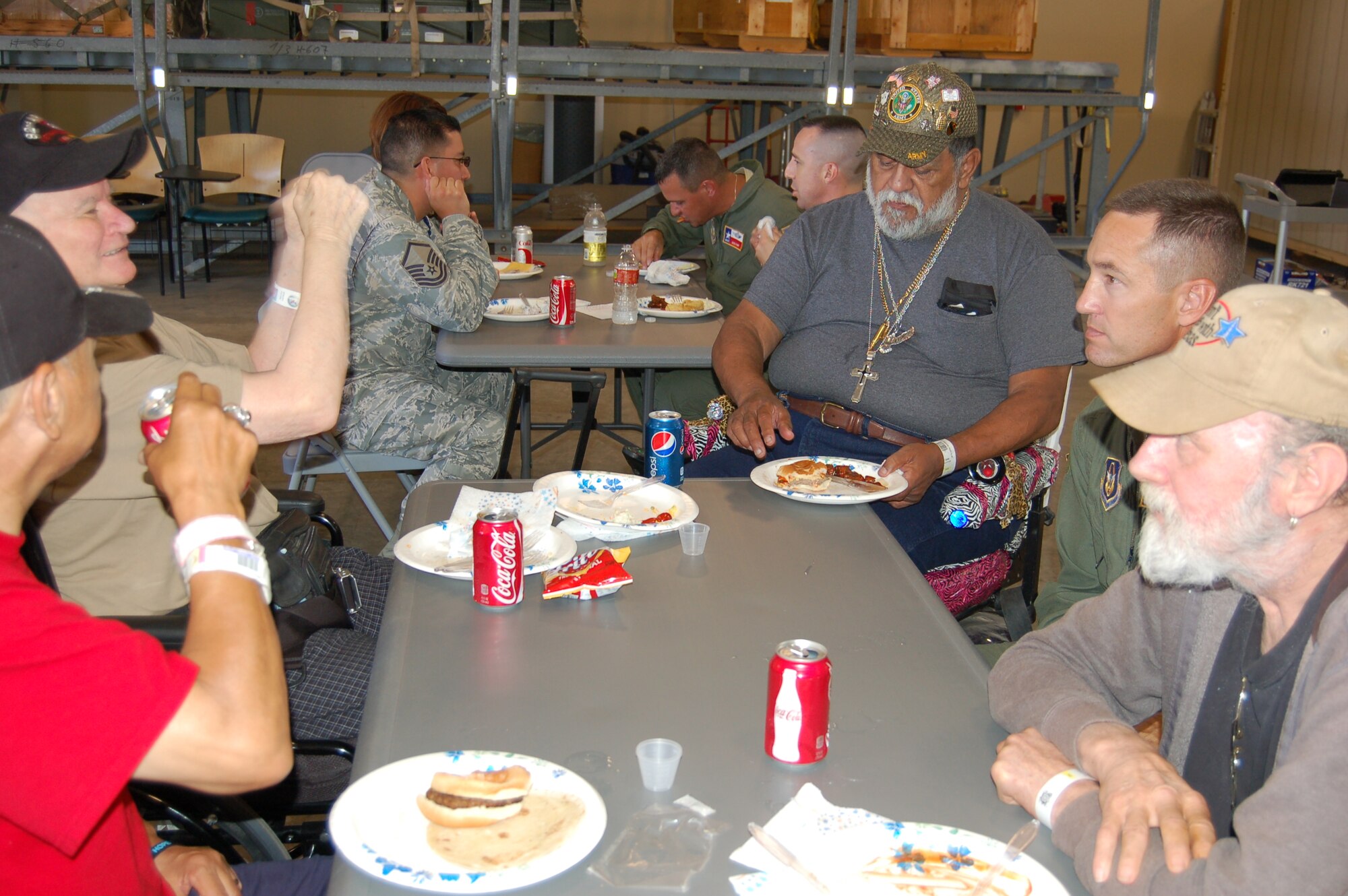 Master Sgt. Tony Wilks, 733rd Training Squadron deputy superintendent, speaks with patients from the Audie L. Murphy Memorial VA Hospital in San Antonio, Texas.  About 40 patients and their families were guests for lunch courtesy of the 733rd TRS.  "This luncheon is one of two annual events we host for VA patients," said Lt. Col. John Martino, 733rd TRS commander,  "It's our way of 'giving back' to the community."  The 733rd TRS is one of two C-5 Galaxy training squadrons assigned to the 433rd Airlift Wing, an Air Force Reserve unit located at Joint Base San Antonio-Lackland, Texas. (U.S. Air Force Photo/Elsa Martinez)