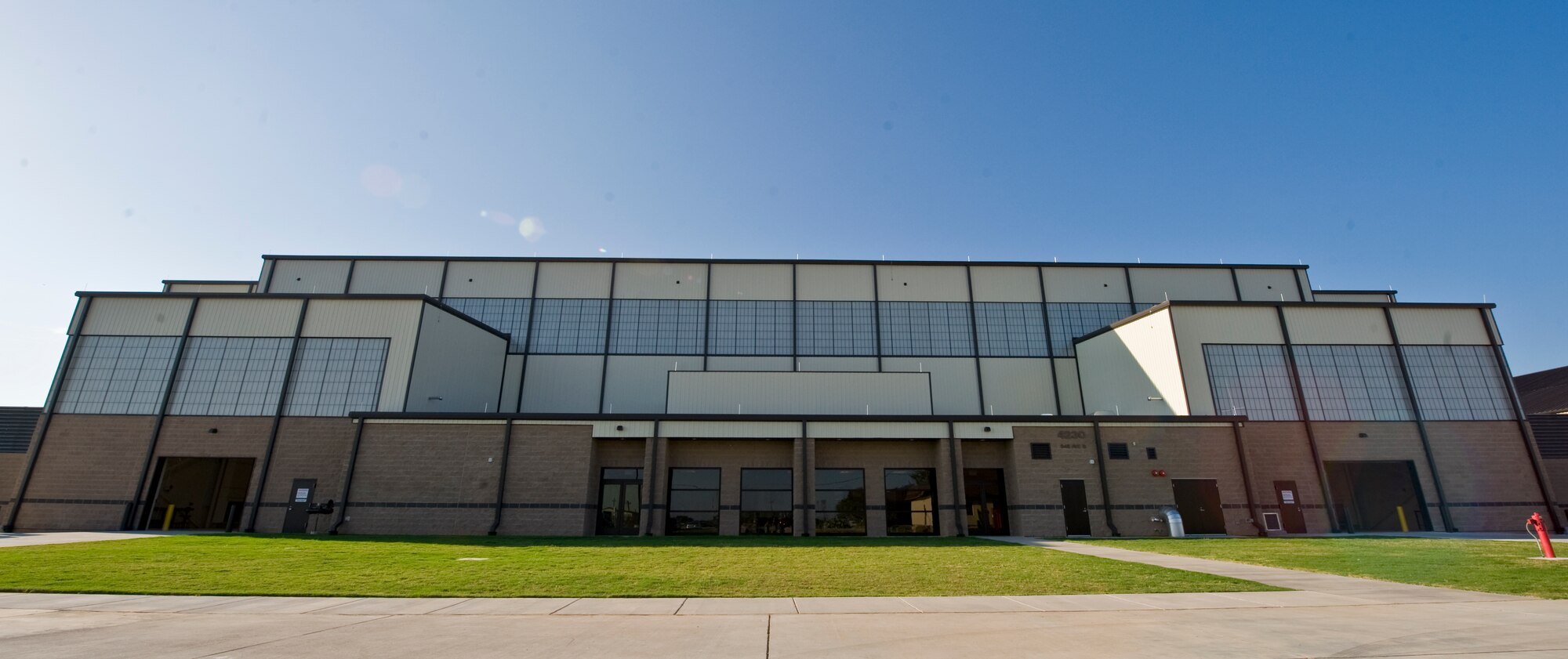 The new 2-Bay Hangar is a 57,000-square-foot facility that provides a two-bay multipurpose hangar to support Dyess’ Global Reach and Global Power missions. The hangar includes fire wall separation between bays and appropriate ventilation systems to accommodate both C-130J and B-1 aircraft. (U.S. Air Force photo by Airman 1st Class Charles V. Rivezzo/ Released)