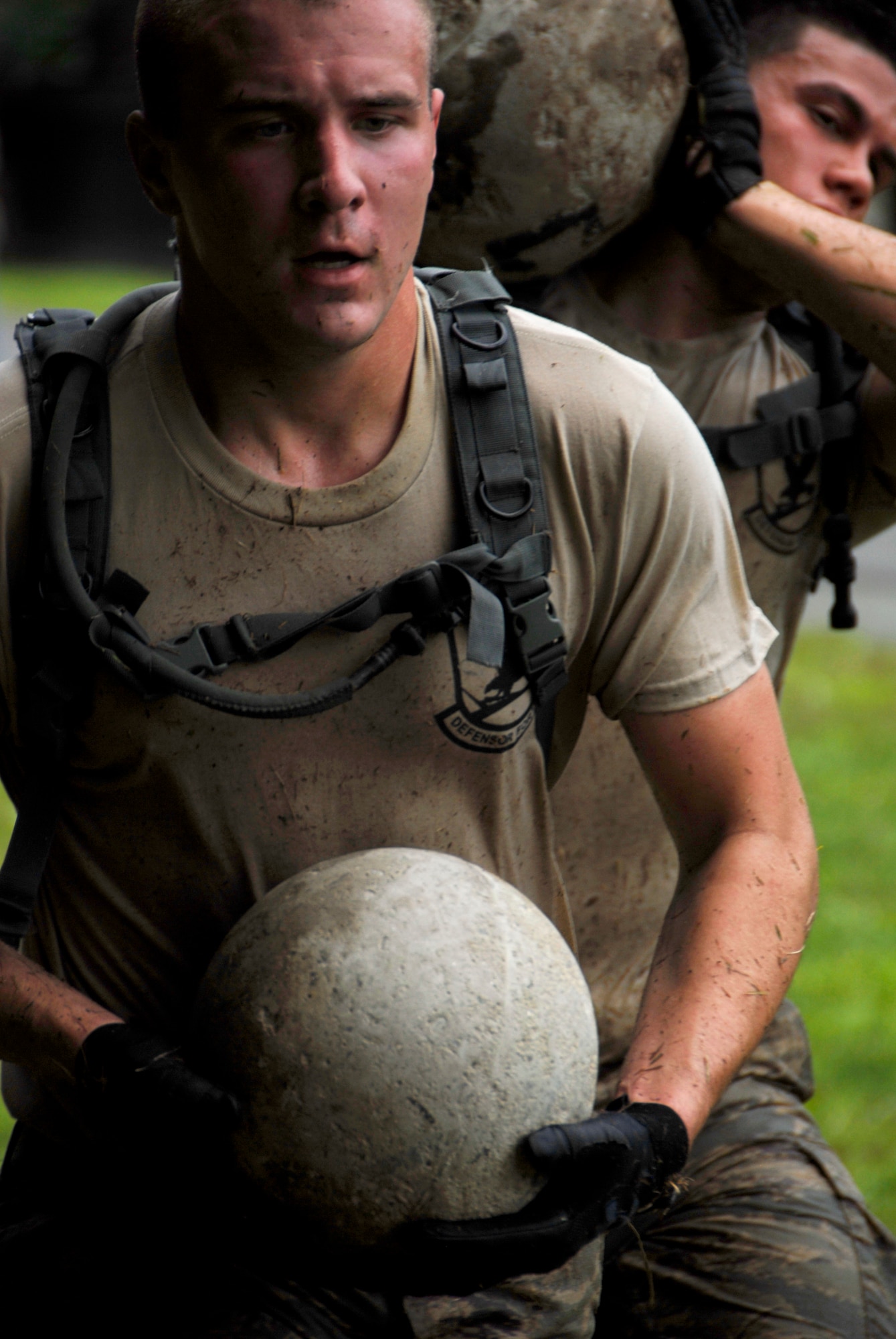 Staff Sgt. Aaron Jerolmon, assigned to the 103rd Security Forces Squadron, carries a weighted ball during the PT portion of the Connecticut SWAT Challenge in West Harford, Conn., Aug. 23, 2012. The Air Guard team took top military team honors for the seventh straight year, fourth in the PT portion and 12th place overall in the annual competition. (U.S. Air Force photo by Senior Airman Jennifer Pierce/Released)