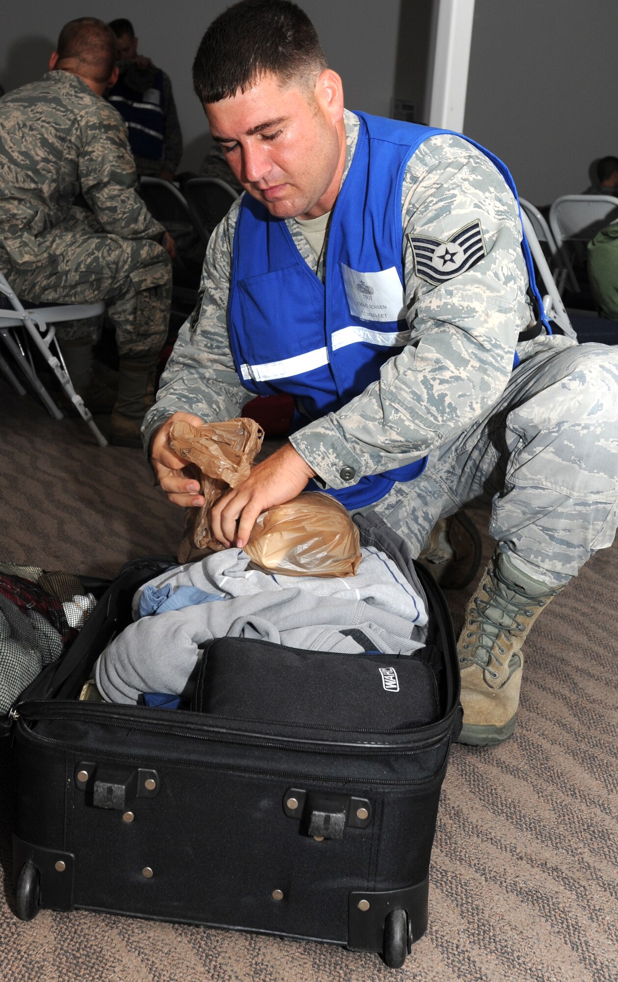 Tech. Sgt. Chad Jensen, 22nd Maintenance Group quality assurance inspector, inspects personal baggage requirements during an operational readiness simulated deployment Sept. 5, 2012, McConnell Air Force Base, Kan. As a QA inspector, Jensen ensures safe and reliable aircraft maintenance is performed on a day-to-day basis. Jensen was chosen as the 22nd MXG spotlight performer for the week of Sept. 3 to 7. (U.S. Air Force photo/ Senior Airman Laura L. Valentine)