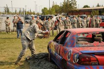 MINOT AIR FORCE BASE, N.D. -- As part of the 91st Missile Wing's Global Strike Challenge kick-off ceremony held Aug. 31, members partook in some car smashing. The festivities signified the wing was ready to take on the challenges ahead. (U.S. Air Force photo/Airman 1st Class Andrew Crawford)