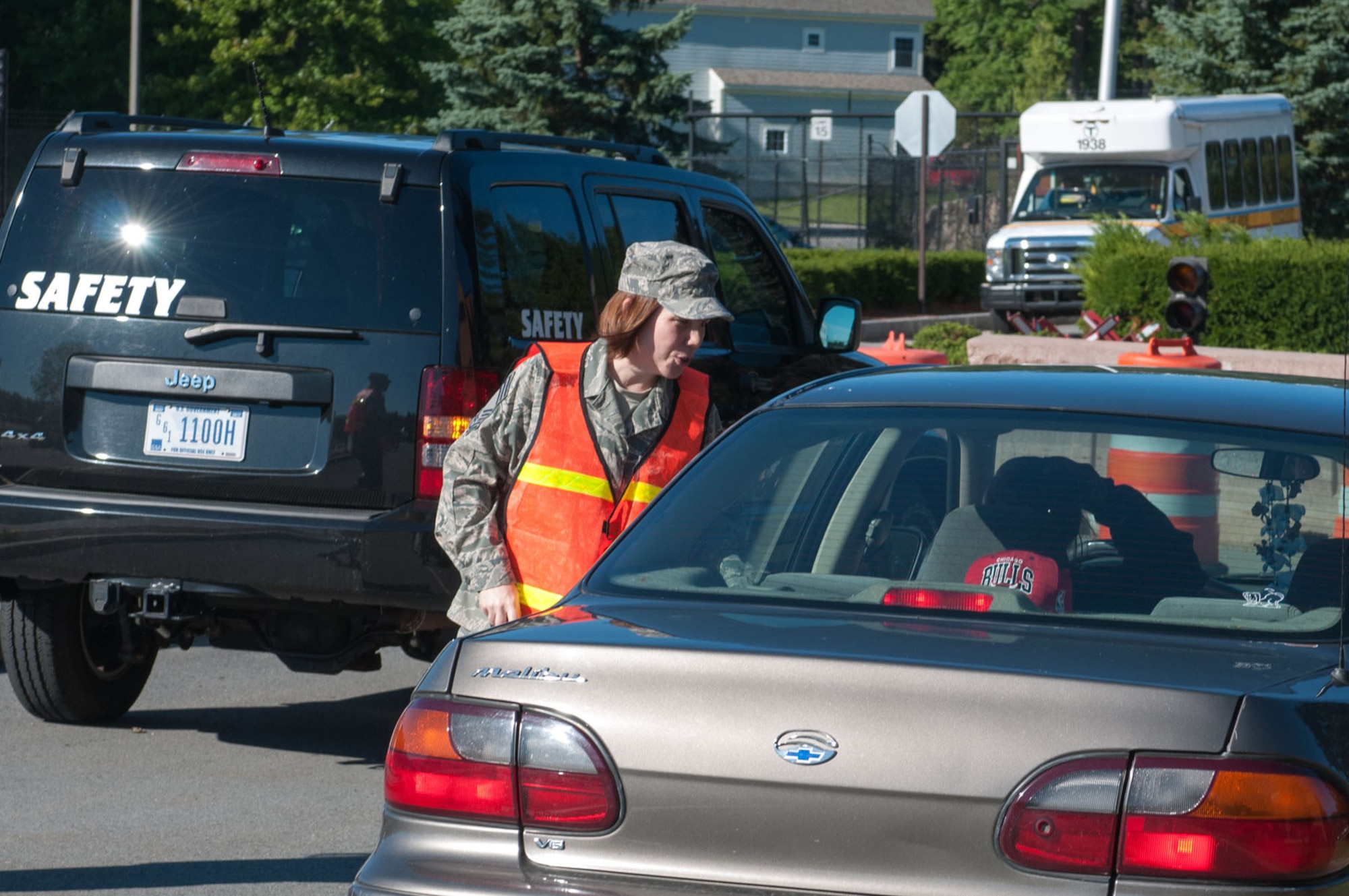 HANSCOM AIR FORCE BASE, Mass. -- Chief Master Sgt. Cindy Rainey, 66th Medical Squadron superintendent, checks seatbelt usage at the Vandenberg Gate Aug. 29. The checks ensured drivers were using their seatbelts properly and enforced the base cell phone policy. This was an Air Force-wide effort just before the Labor Day holiday. (US Air Force Photo by Rick Berry)