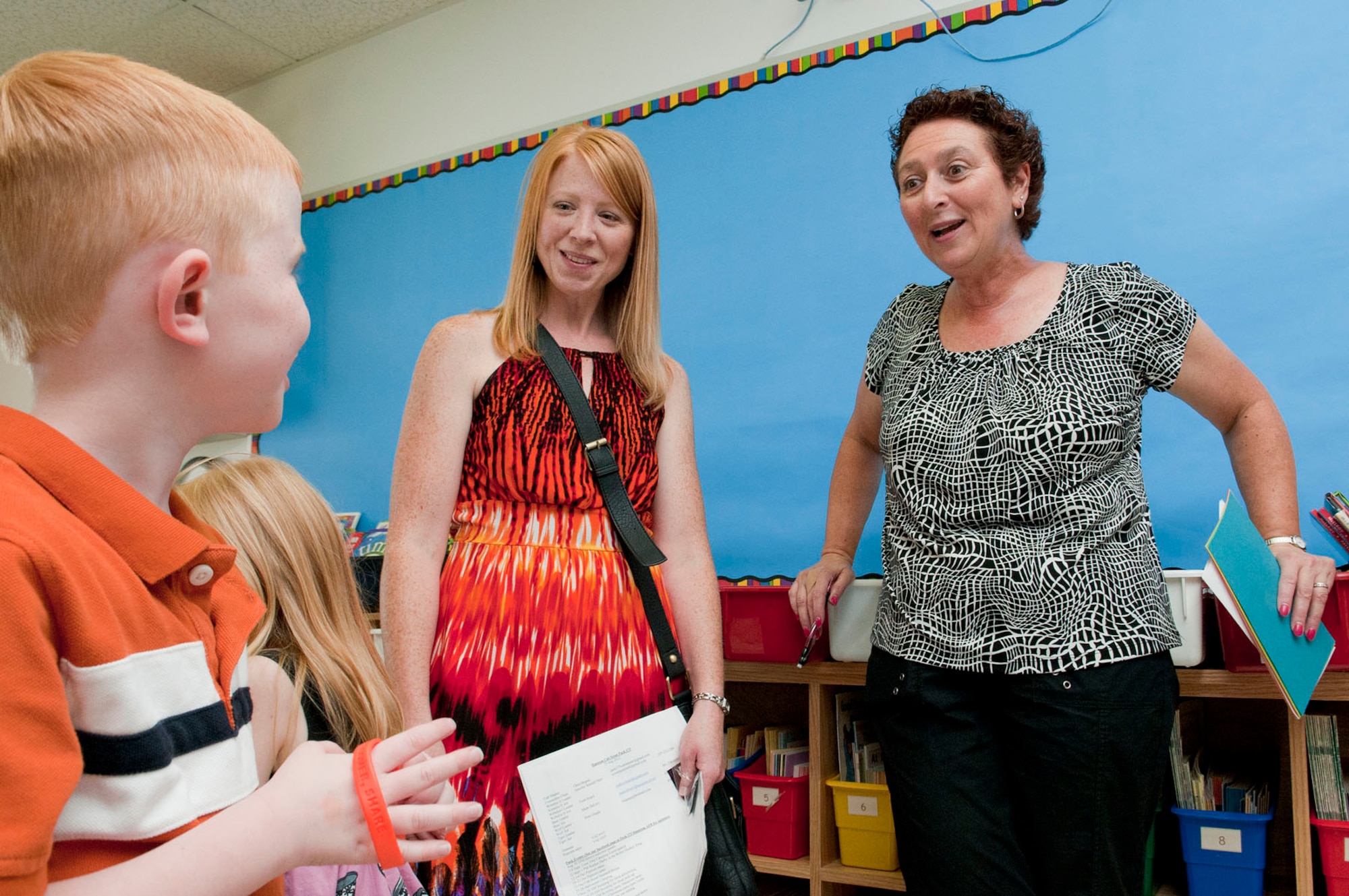 HANSCOM AIR FORCE BASE, Mass. -- Carol Mahn (right), a first grade teacher at the Hanscom Primary School, meets Melissa Weyand and her son, Maximas, during a "Meet and Greet" at the school Aug. 30. The primary and middle schools hosted the event as a way for parents and students to meet teachers, check class lists, purchase school spirit wear and find out more about the Parent Teacher Organization before the start of the new school year. (U.S. Air Force photo by Mark Wyatt)