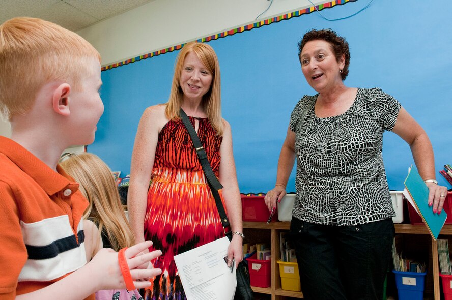 HANSCOM AIR FORCE BASE, Mass. -- Carol Mahn (right), a first grade teacher at the Hanscom Primary School, meets Melissa Weyand and her son, Maximas, during a "Meet and Greet" at the school Aug. 30. The primary and middle schools hosted the event as a way for parents and students to meet teachers, check class lists, purchase school spirit wear and find out more about the Parent Teacher Organization before the start of the new school year. (U.S. Air Force photo by Mark Wyatt)