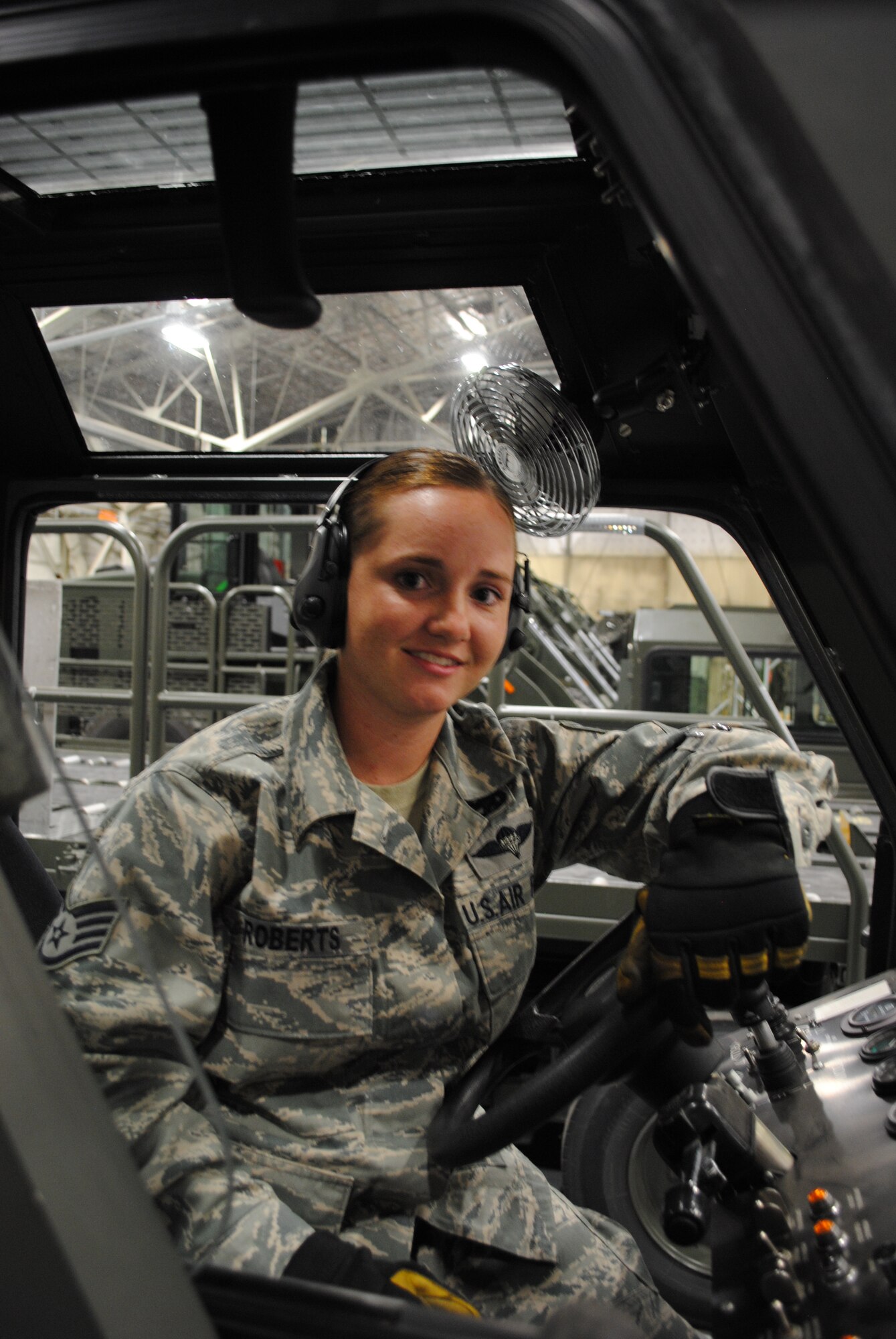 Staff Sgt. Chelsea Roberts, 319th Logistics Readiness Squadron, sits inside a Halvorsen k-loader used for transporting heavy cargo onto military aircraft, Sept. 5, 2012, at the terminal operation building on Grand Forks Air Force Base, N.D. Roberts is in-charge of managing training scenarios during exercises  used to prepare Grand Forks AFB Airmen for operational readiness inspections . U.S. Air Force photo/Senior Airman Luis Loza Gutierrez)