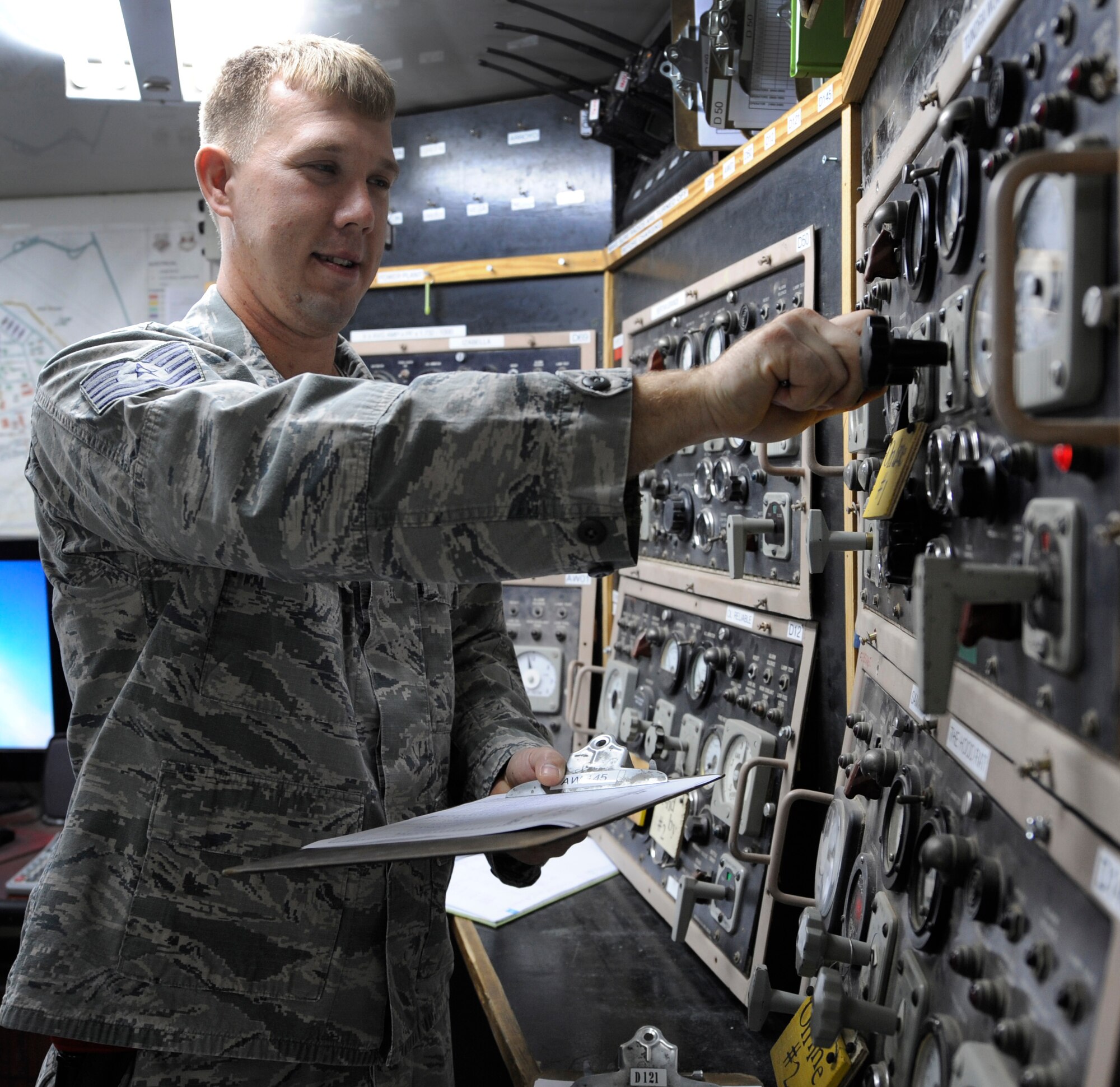 SOUTHWEST ASIA – Tech. Sgt. Adam Grooms, 386th Expeditionary Civil Engineer Squadron electrical power production, performs hourly checks on the control panel supporting the generators of Commando Village here August 21. Grooms and his co-workers provide and sustain base infrastructure pertaining to electrical power production and servicing and maintaining aircraft arresting systems. Grooms is the 386th Air Expeditionary Wing’s Rock Solid Warrior. (U.S Air Force photo/Staff Sgt. Alexandra M. Boutte)