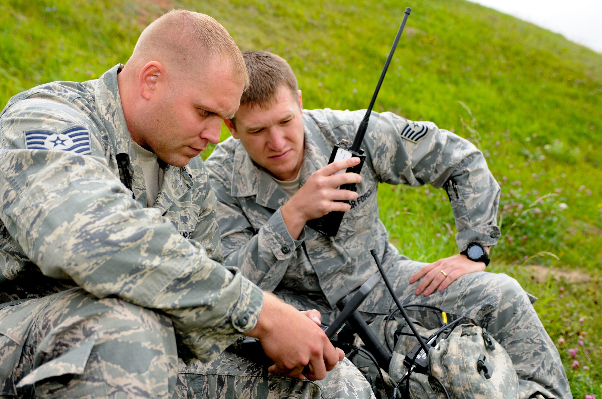 SPANGDAHLEM AIR BASE, Germany -- Tech. Sgt. Nick Reddinger, left, and Tech. Sgt. John Butler, 2nd Air Support Operations Squadron tactical air control party specialists (TACPs) from U.S. Army Garrison Grafenwoehr, use digital communication equipment to send target information to an A-10 Thunderbolt II pilot here Sept. 5. The information sent is critical as it shares an enemy target’s exact coordinates to the pilots overhead. The TACPs visited the base to assist the 81st Fighter Squadron with sharing close-air-support tactics, techniques and procedures with U.S.  Army UH-72 Lacota helicopter pilots . The 81st FS shares and exchanges operating procedures with joint forces to ensure interoperability in future training exercises and contingency operations.  (U.S. Air Force photo by Senior Airman Natasha Stannard/Released)
