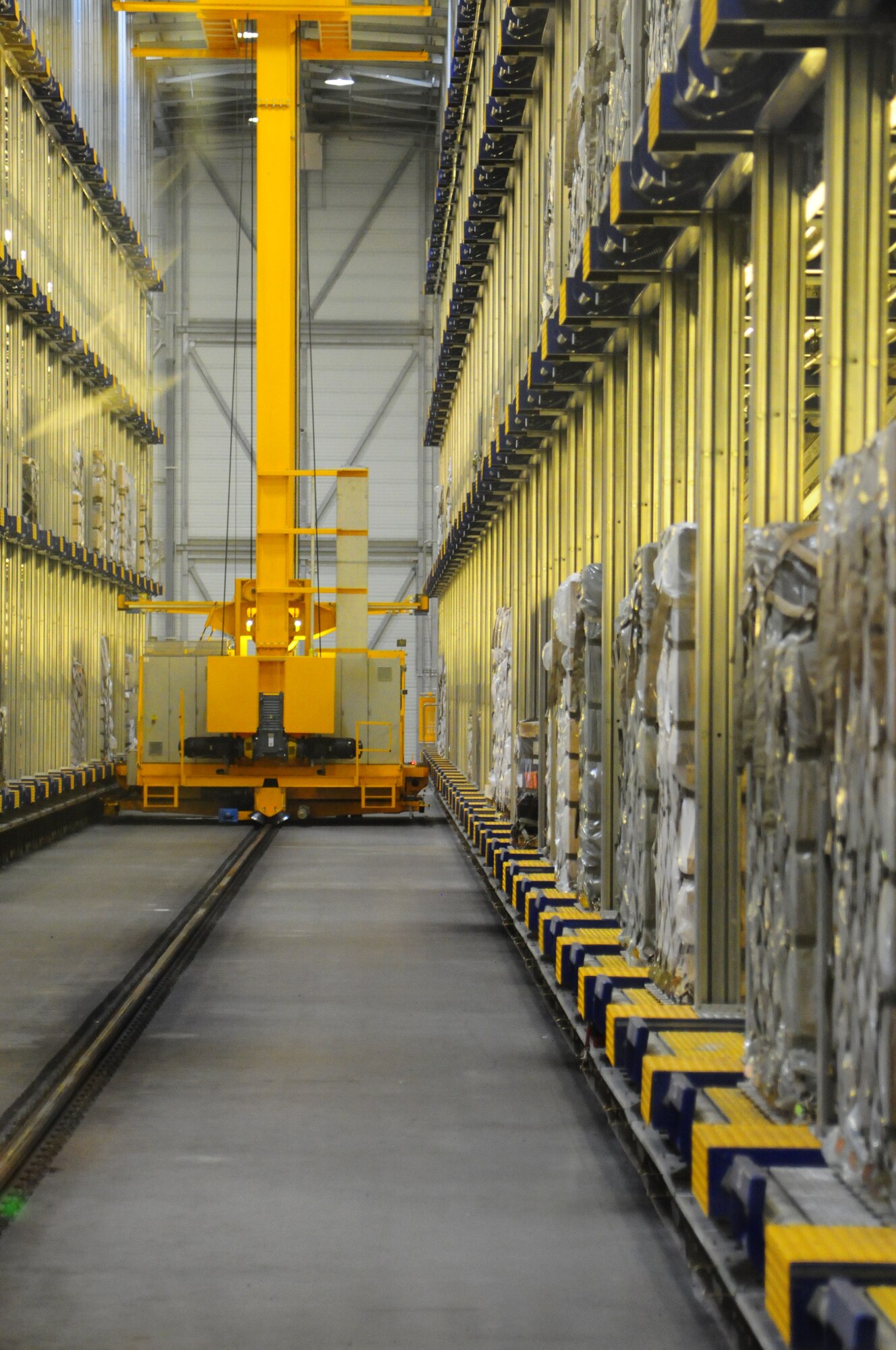 The Mechanized Material Handling System pulls cargo for an outgoing flight Aug. 22, 2012 on Ramstein Air Base, Germany.  The MMHS helps sort and prioritizes pallets to expedite the cargo loading and unloading process. 