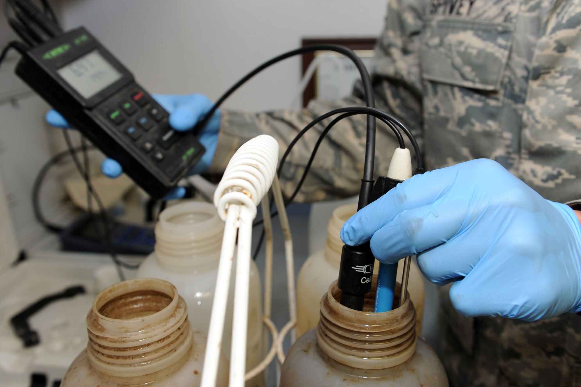SPANGDAHLEM AIR BASE, Germany –Senior Airman David Spivey, 52nd Civil Engineer Squadron water and fuels system maintenance technician, uses a meter to check the chemical level and temperature of a sample of wastewater during a daily inspection at the wastewater treatment facility here Sept. 5. Samples are taken daily from every stage of the treatment process to ensure they meet German environmental standards. The facility processes wastewater from the base to remove any hazardous chemicals it may contain before it is released back into the environment. (U.S. Air Force photo by Senior Airman Christopher Toon/Released)