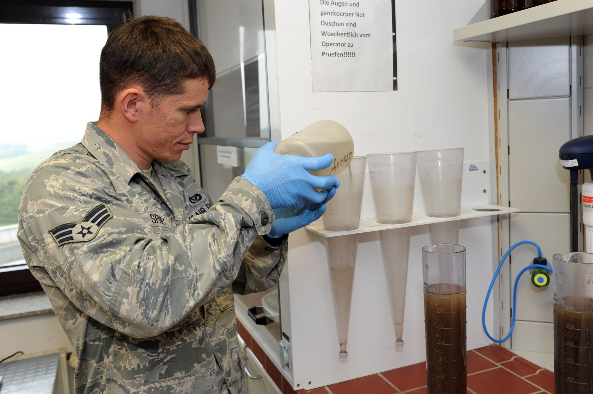SPANGDAHLEM AIR BASE, Germany –Senior Airman David Spivey, 52nd Civil Engineer Squadron water and fuels system maintenance technician, conducts a sediment test at the wastewater treatment facility here Sept. 5. This test is conducted to ensure the excess non-soluble material is sifted out prior to the water treatment. Samples are taken daily from every stage of the treatment process to ensure they meet German environmental standards. The facility processes wastewater from the base to remove any hazardous chemicals it may contain before it is released back into the environment. (U.S. Air Force photo by Senior Airman Christopher Toon/Released)