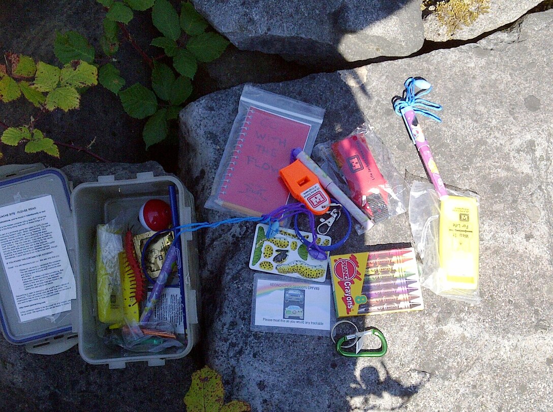 Geocaches can contain a variety of treasures inside--either to take as souvenirs or left behind as tokens from other geocachers.
