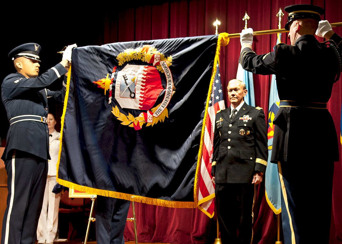 Army Gen. Martin E. Dempsey, chairman of the Joint Chiefs of Staff, watches the uncasing of the Eisenhower School flag during the ceremony to rename the Industrial College of Armed Forces to The Dwight D. Eisenhower School for National Security and Resource Strategy at National Defense University on Fort McNair in Washington, D.C., Sept. 6, 2012.