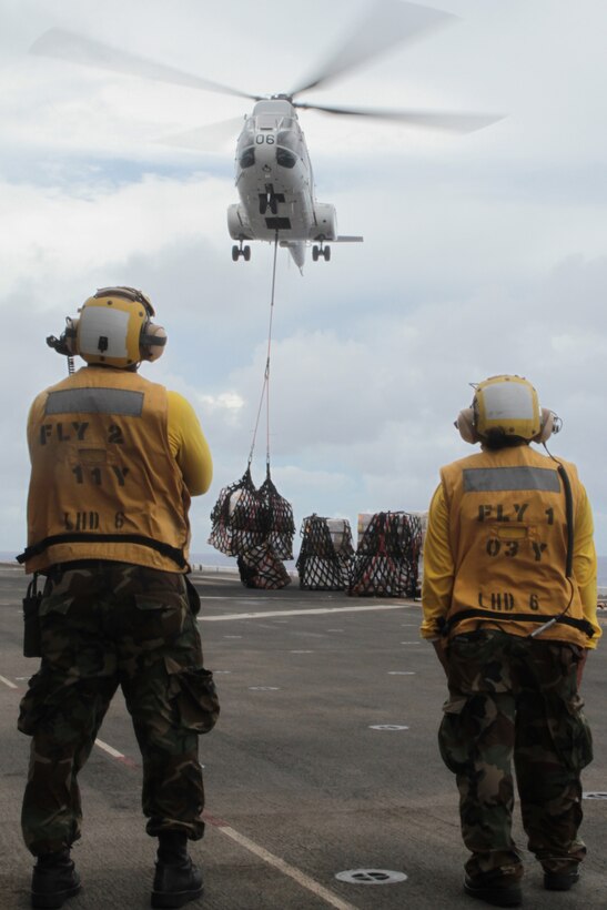 An FA-330J Puma helicopter drops off pallets of food and supplies during a Replenishment At Sea operation here, September 4. Over 260 crates of food and supplies were transferred by using a FA-330J Puma Helicopter while simultaneously pumping over 800,000 gallons of fuel onto the BHR. The 31st MEU is the only continuously forward-deployed MEU and is the Marine Corps’ force in readiness in the Asia-Pacific region.