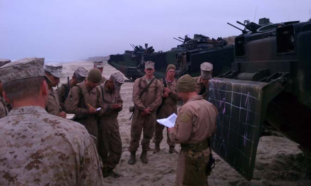 Lt. Illies of 1st Platoon issues the order to the Marines on White Beach for their culminating exercise.
