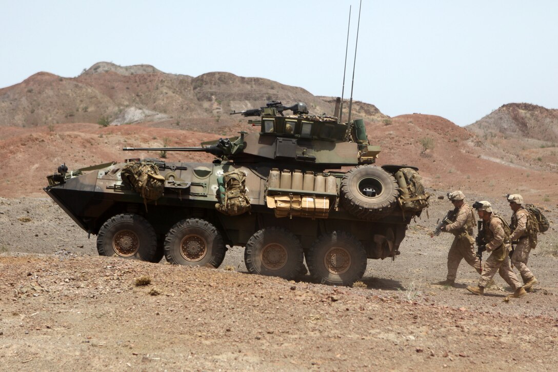 Marines with the 24th Marine Expeditionary Unit's Light Armored Reconnaissance platoon, Battalion Landing Team 1st Battalion, 2nd Marine Regiment, move toward their objective during a bilateral training raid with French Marines in Djibouti, Aug. 27, 2012. A small contingent of the 24th MEU is currently ashore in Djibouti conducting various unilateral, bilateral and joint exercises. The 24th MEU is deployed with the Iwo Jima Amphibious Ready Group as a theater reserve and crisis response force for U.S. Central Command and U.S. 5th Fleet area of responsibility.