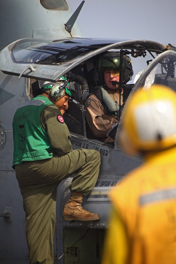 Marines with Marine Medium Tiltrotor Squadron 261 (Reinforced), 24th Marine Expeditionary Unit, conduct maintenance ground turns with an AH-1W Super Cobra aboard the USS Iwo Jima, Aug 27, 2012, to ensure the helicopter's components are working properly prior to conducting flight operations. The Cobras are part of the "Skid" detachment for VMM-261 (Rein) originally assigned to Marine Light Attack Helicopter Squadron 269 based at Marine Corps Air Station New River, N.C.  The 24th MEU is deployed with the Iwo Jima Amphibious Ready Group as a theater reserve force for U.S. Central Command and is providing support for maritime security operations and theater security cooperation efforts in the U.S. Navy's 5th Fleet area of responsibility.